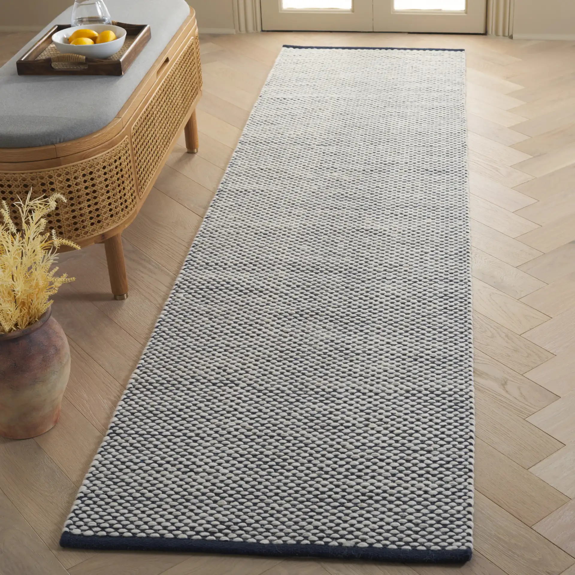 Vermont Heathered Flatweave Wool Rug in Navy / Ivory in a styled room