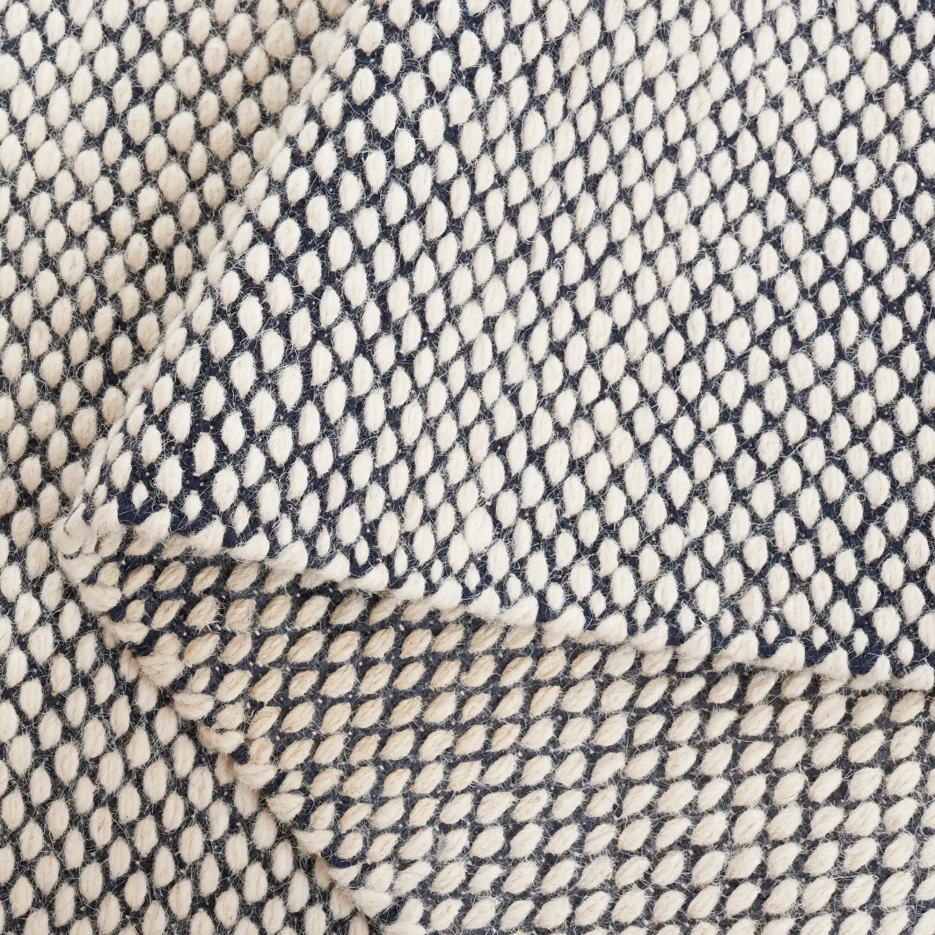 Vermont Heathered Flatweave Wool Rug in Navy / Ivory in a styled room