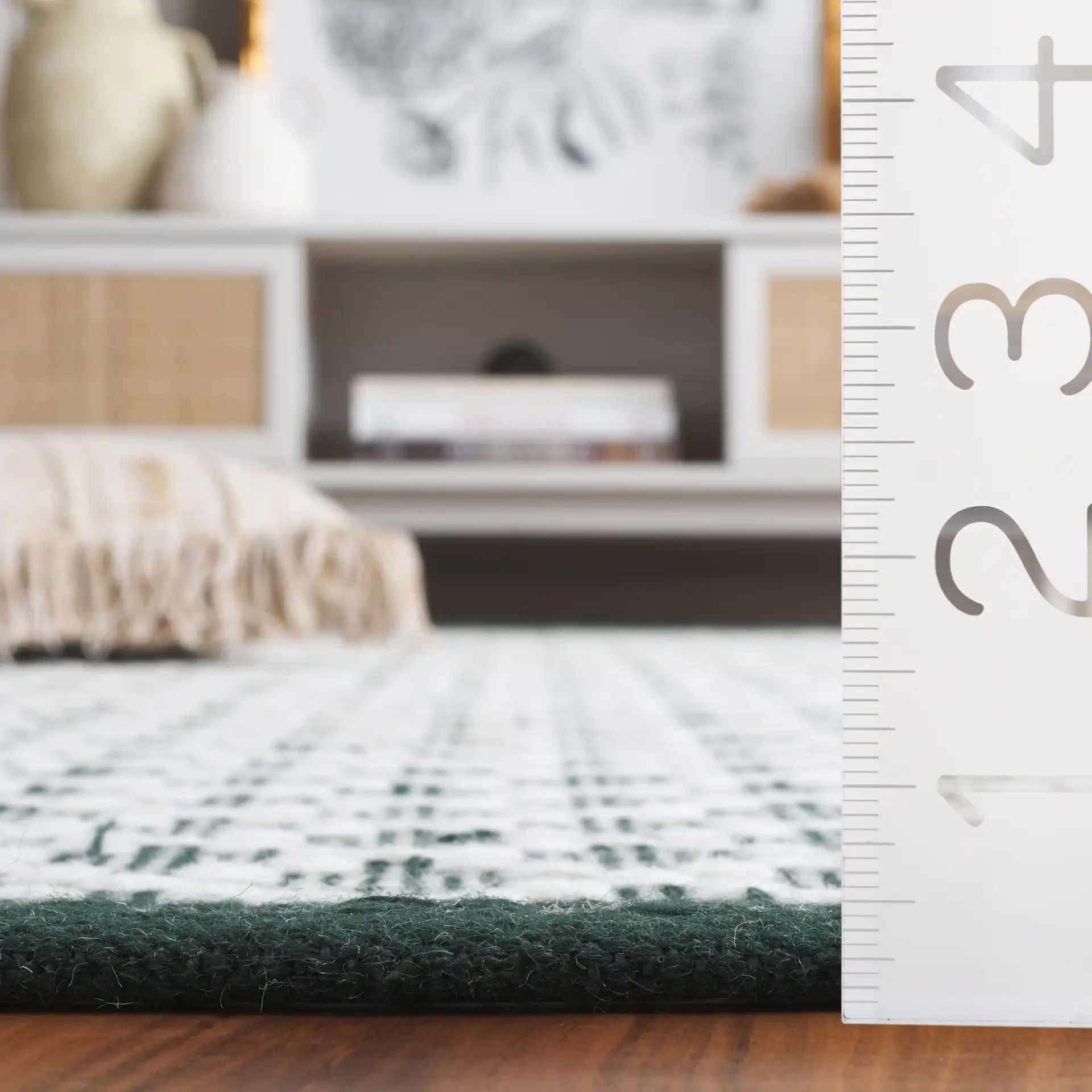 Vermont Micro Diamond Hand-Woven Wool Rug in Green / Ivory in a styled room