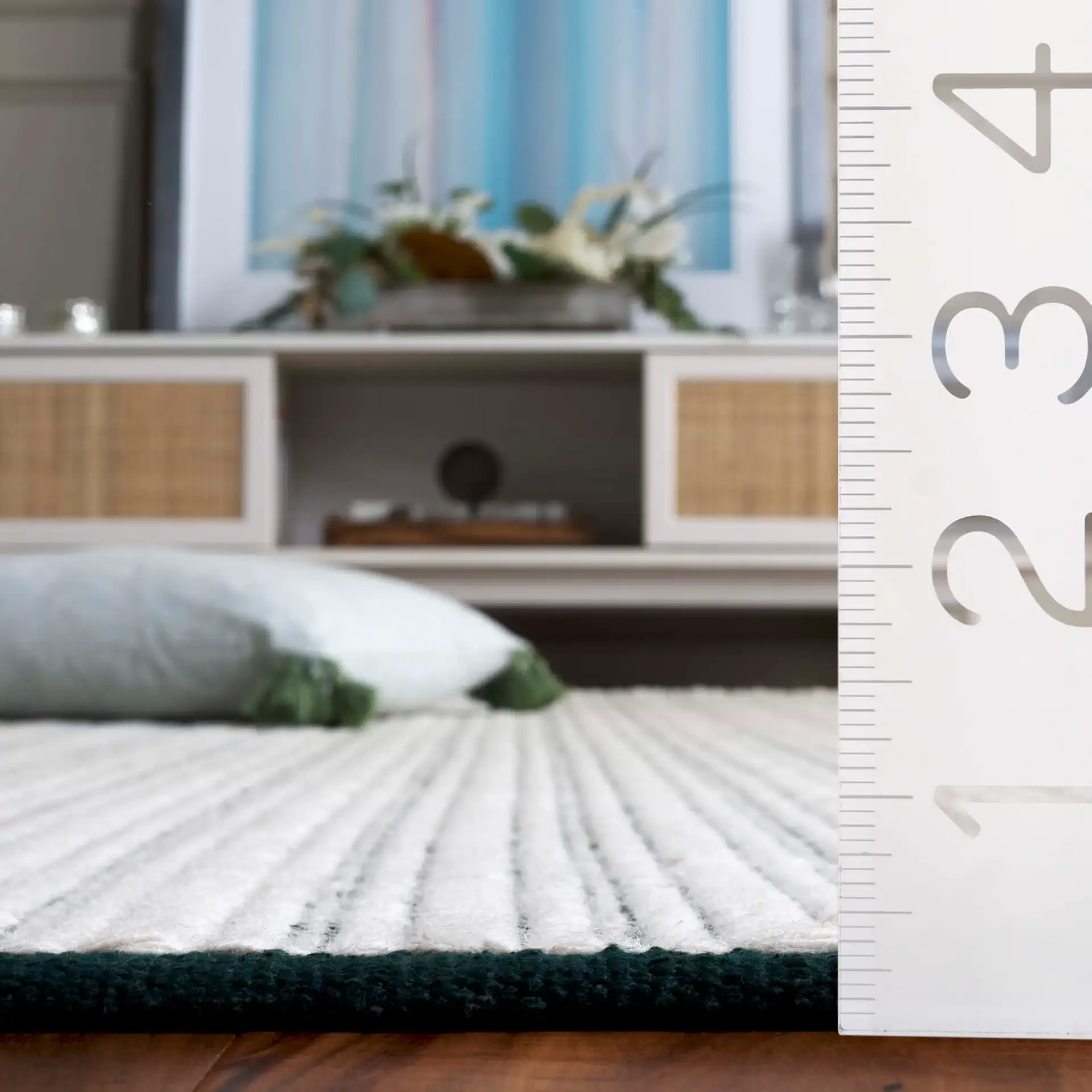 Vermont Pinstripe Hand-Woven Rug in Green / Ivory in a styled room