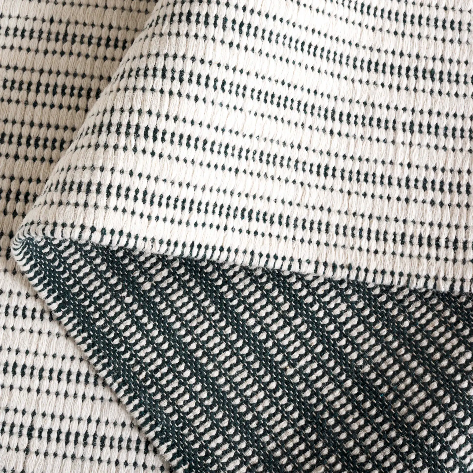 Vermont Pinstripe Hand-Woven Rug in Green / Ivory in a styled room