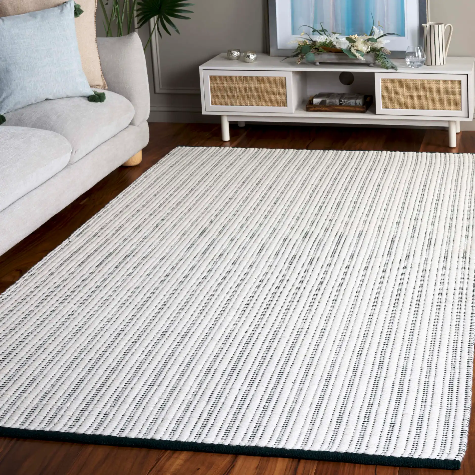 Vermont Pinstripe Hand-Woven Rug in Green / Ivory in a styled room