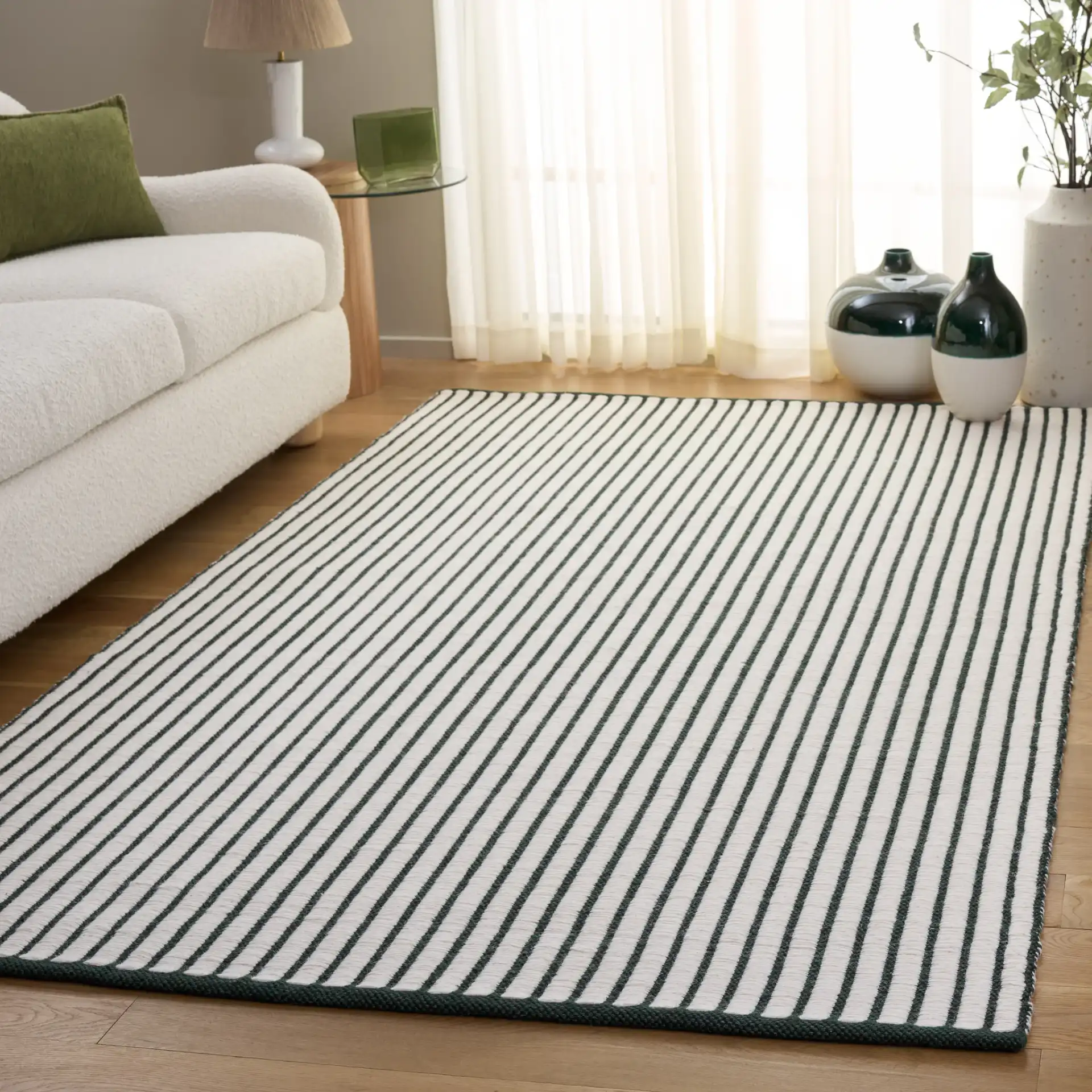 Vermont Pinstripe Hand-Woven Wool Rug in Dark Green / Ivory in a styled room