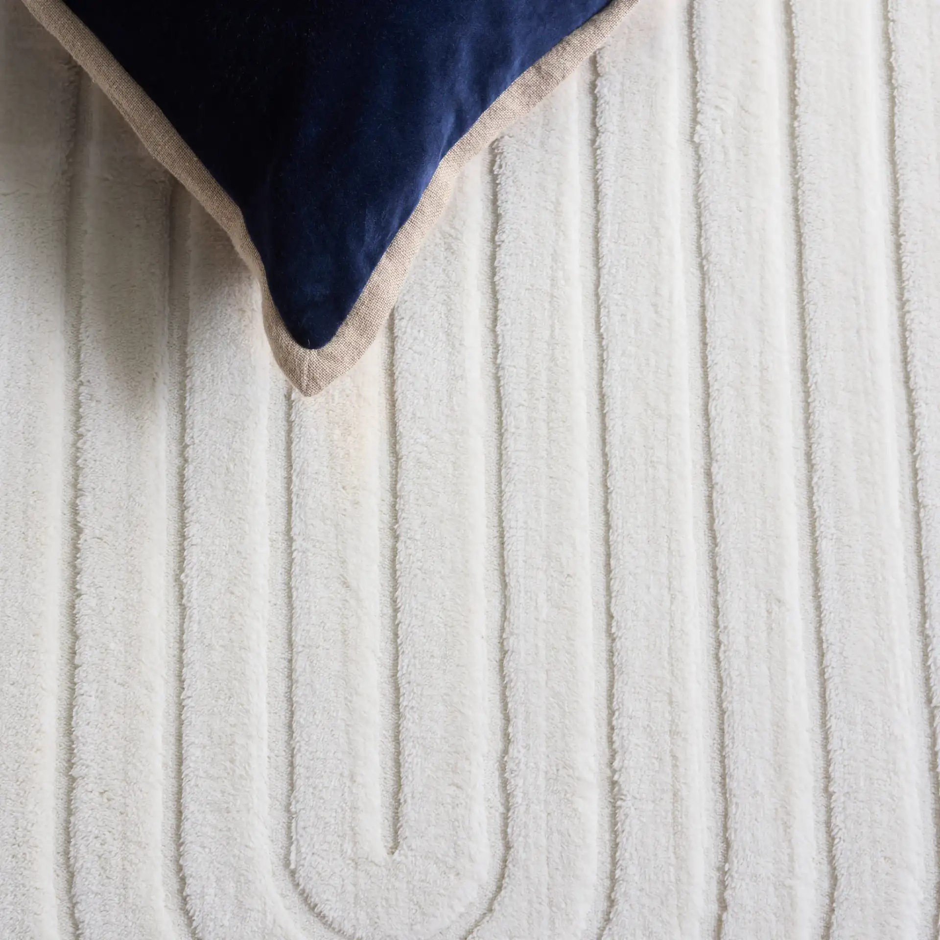 Versailles Concentric Arches Washable Rug in Ivory in a styled room