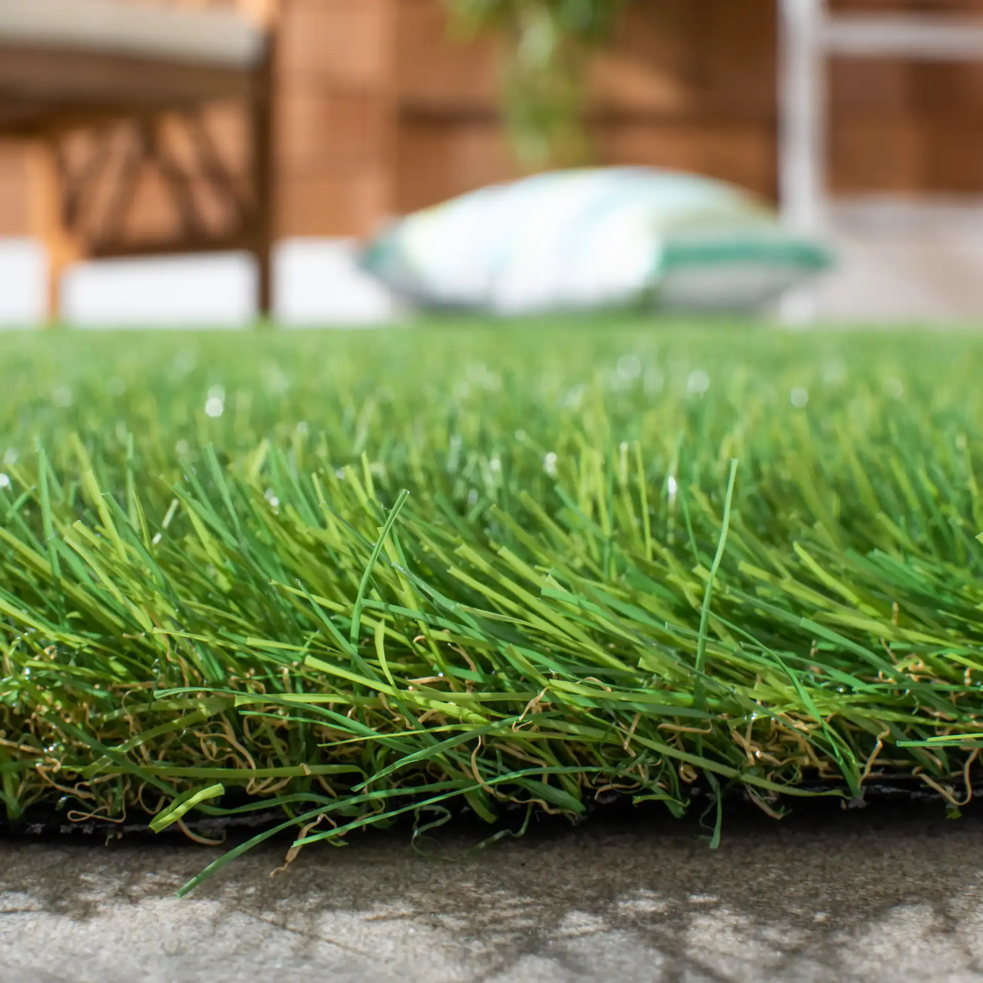Turf Solid Outdoor Rug in Green in a styled room