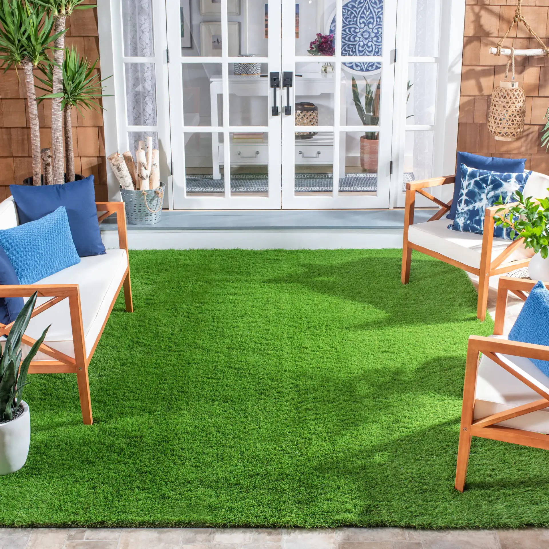 Turf Solid Outdoor Rug in Green in a styled room