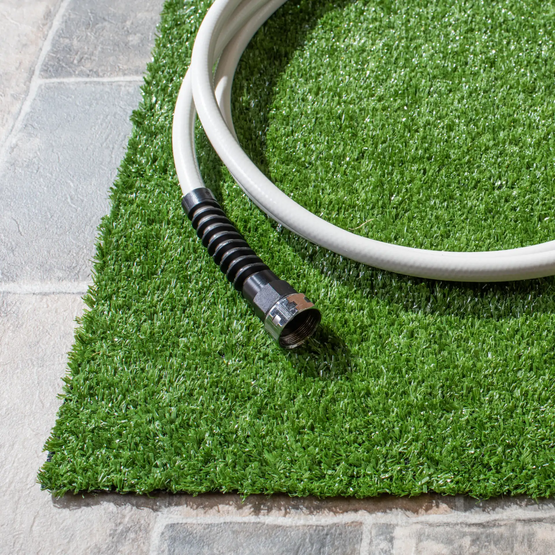Turf Solid Runner Outdoor Rug in Green in a styled room