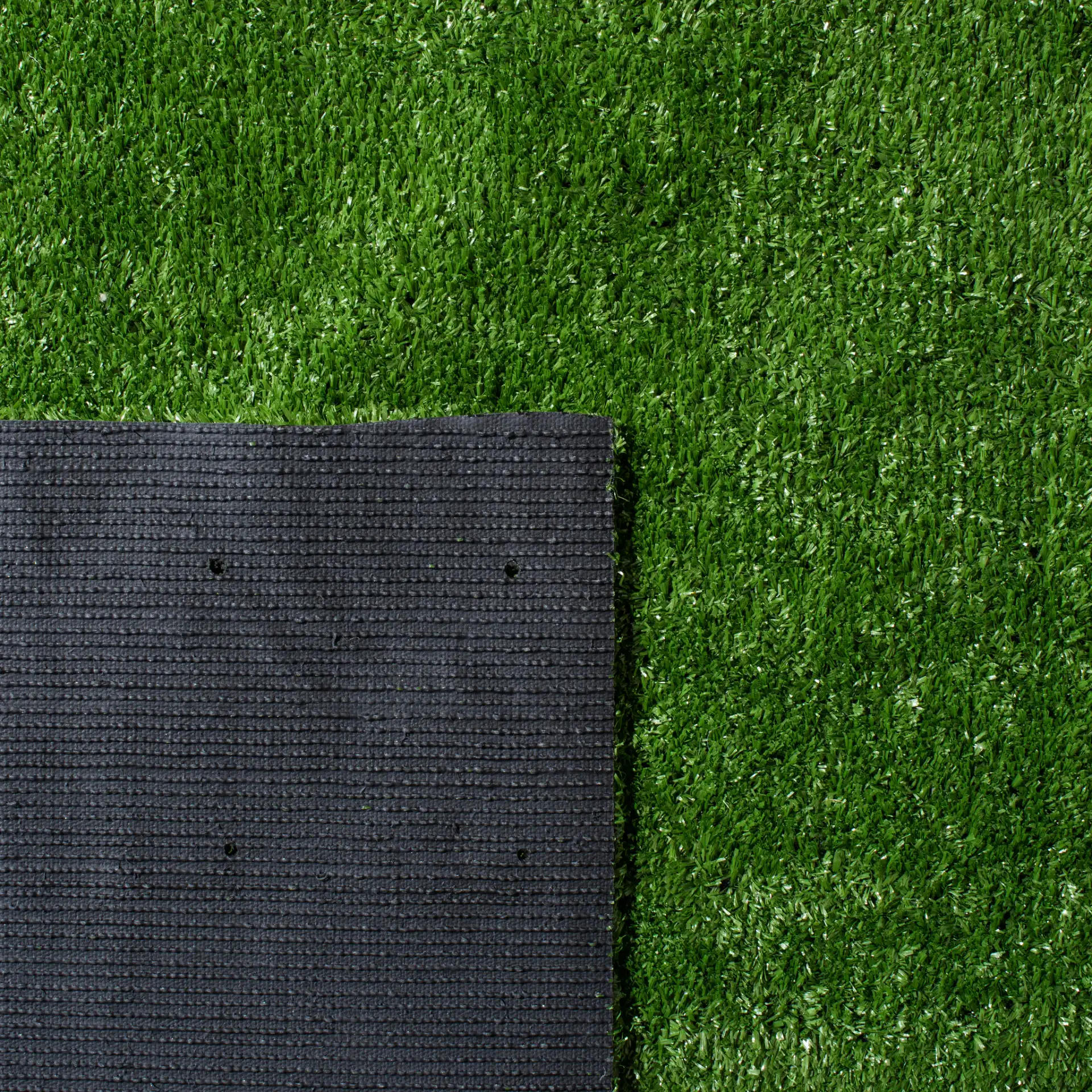 Turf Solid Runner Outdoor Rug in Green in a styled room
