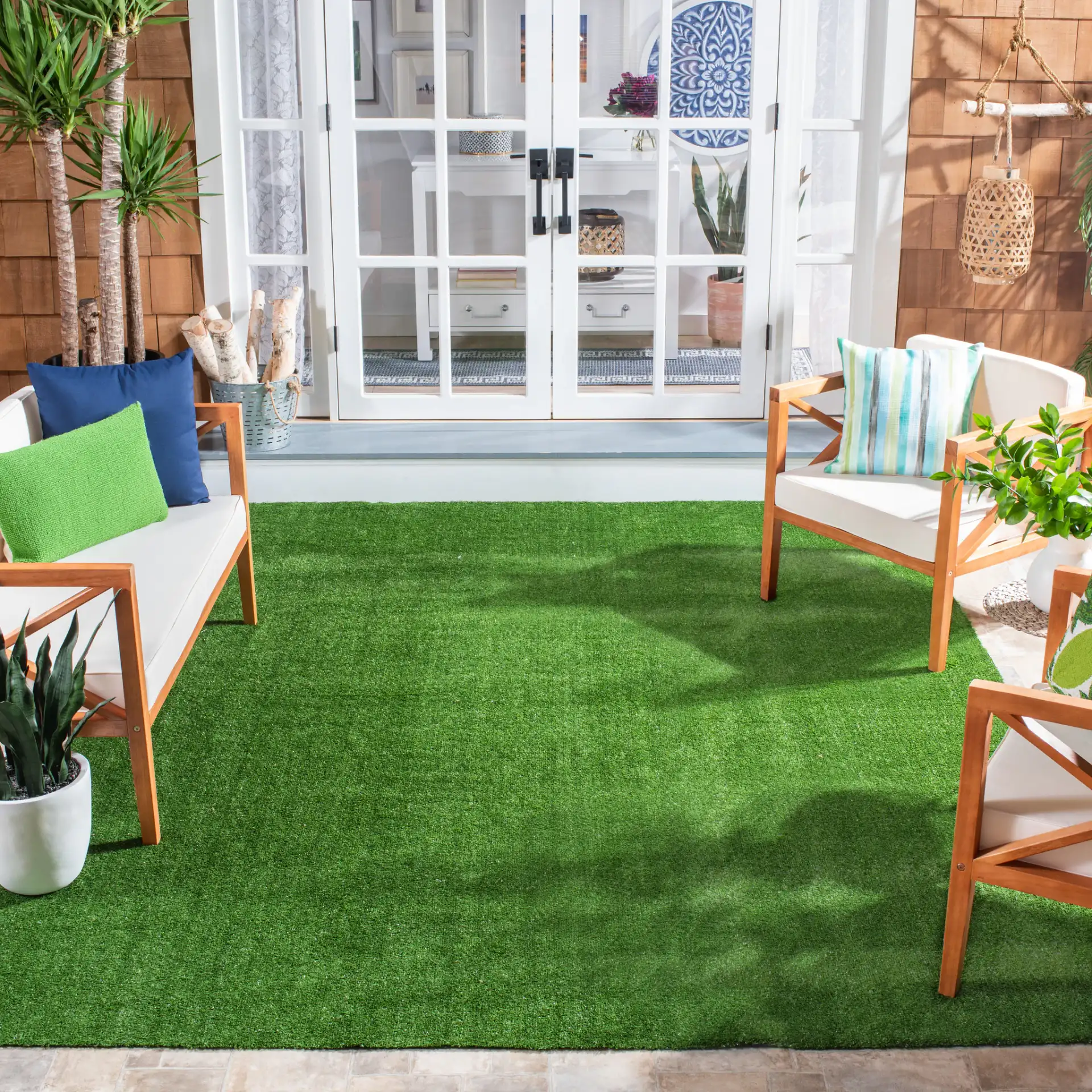 Turf Solid Runner Outdoor Rug in Green in a styled room