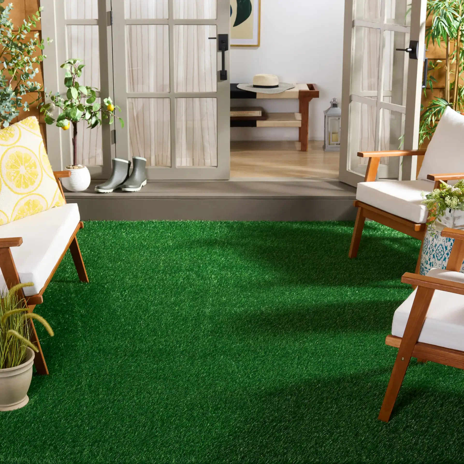 Turf Modern Solid Outdoor Rug in Green / Light Green in a styled room