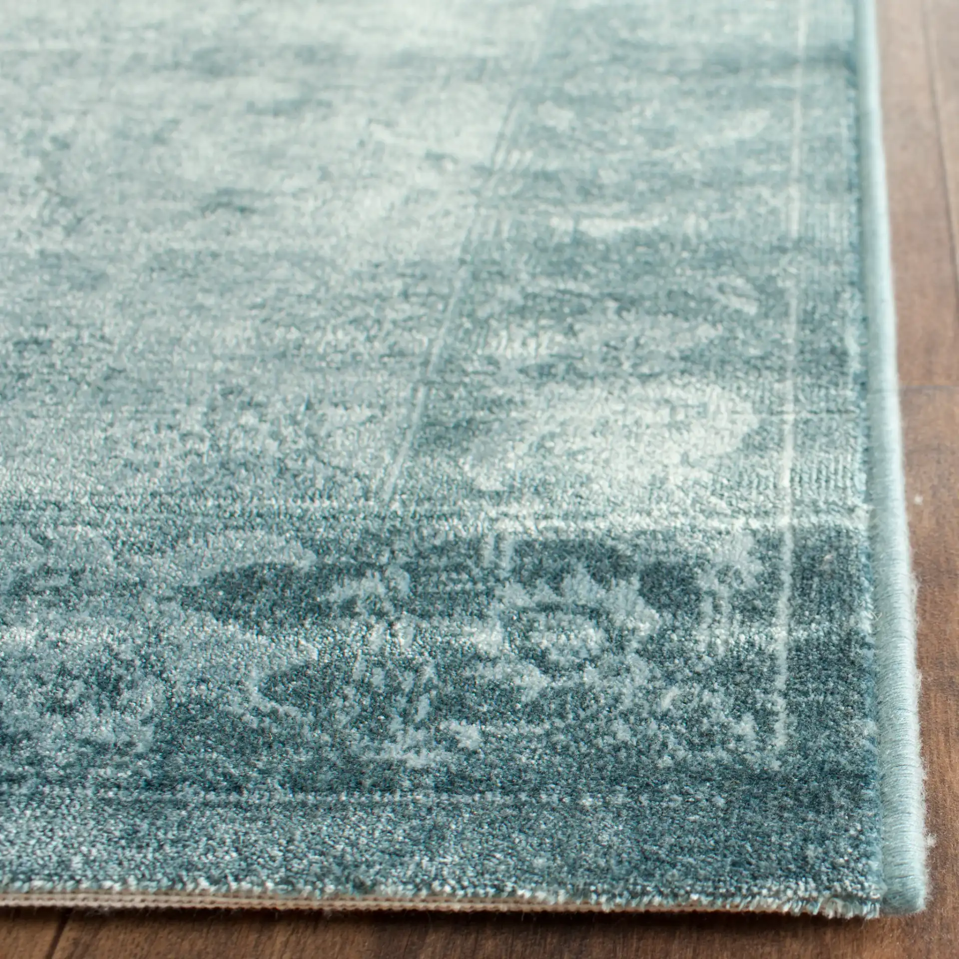 Vintage Traditional Floral Border Viscose Rug in Light Blue / Dark Blue in a styled room