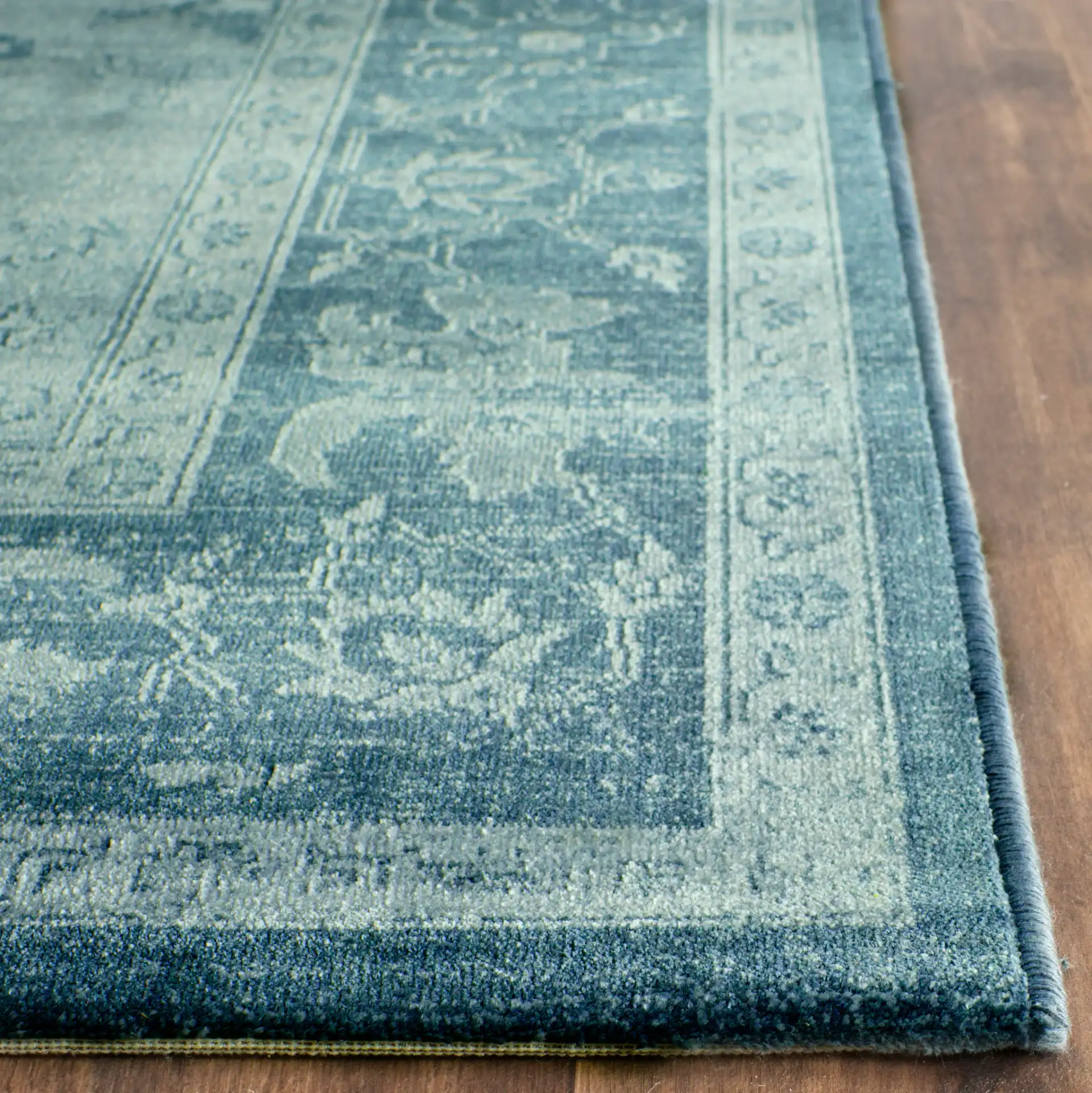 Vintage Traditional Floral Border Viscose Rug in Light Blue / Dark Blue in a styled room