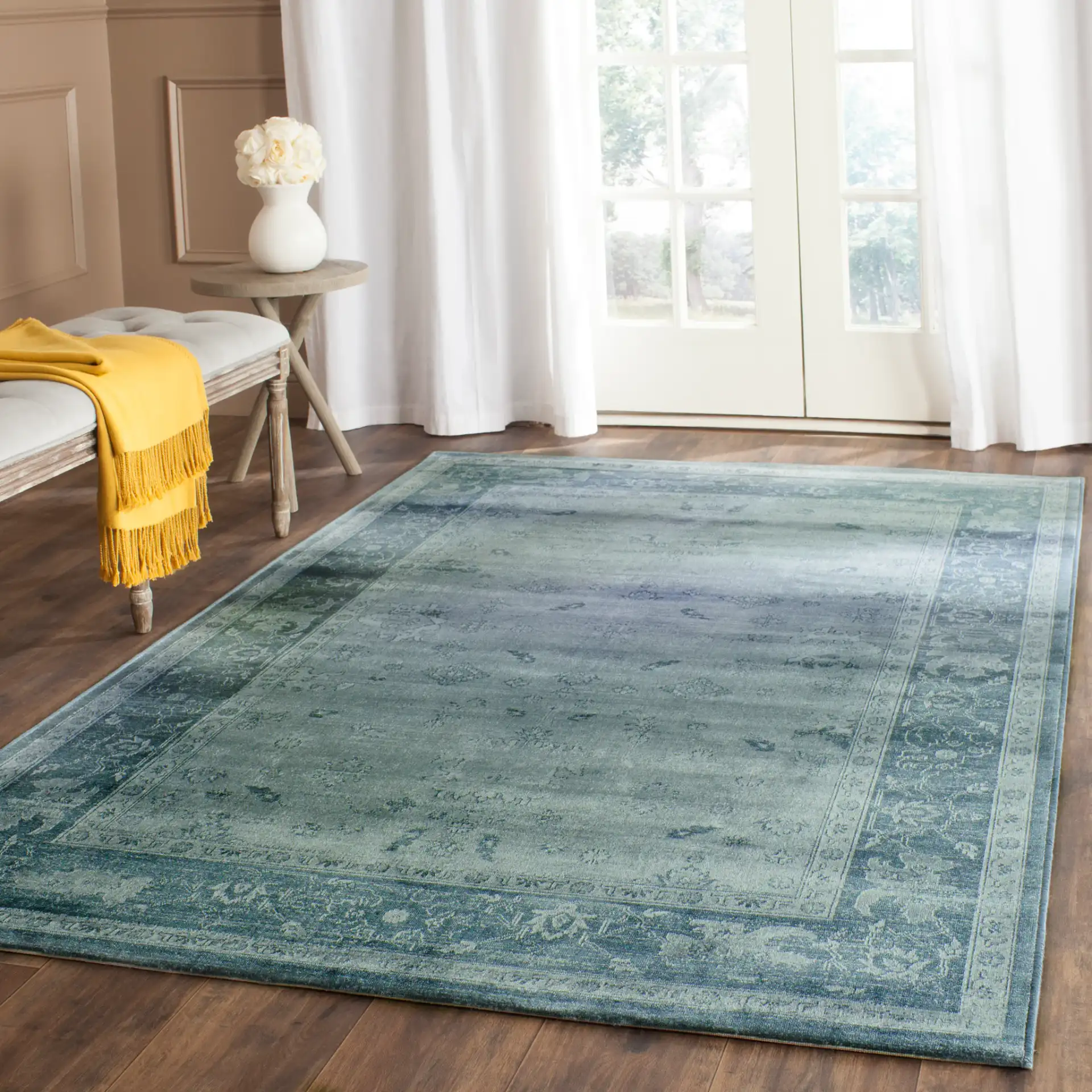 Vintage Traditional Floral Border Viscose Rug in Light Blue / Dark Blue in a styled room