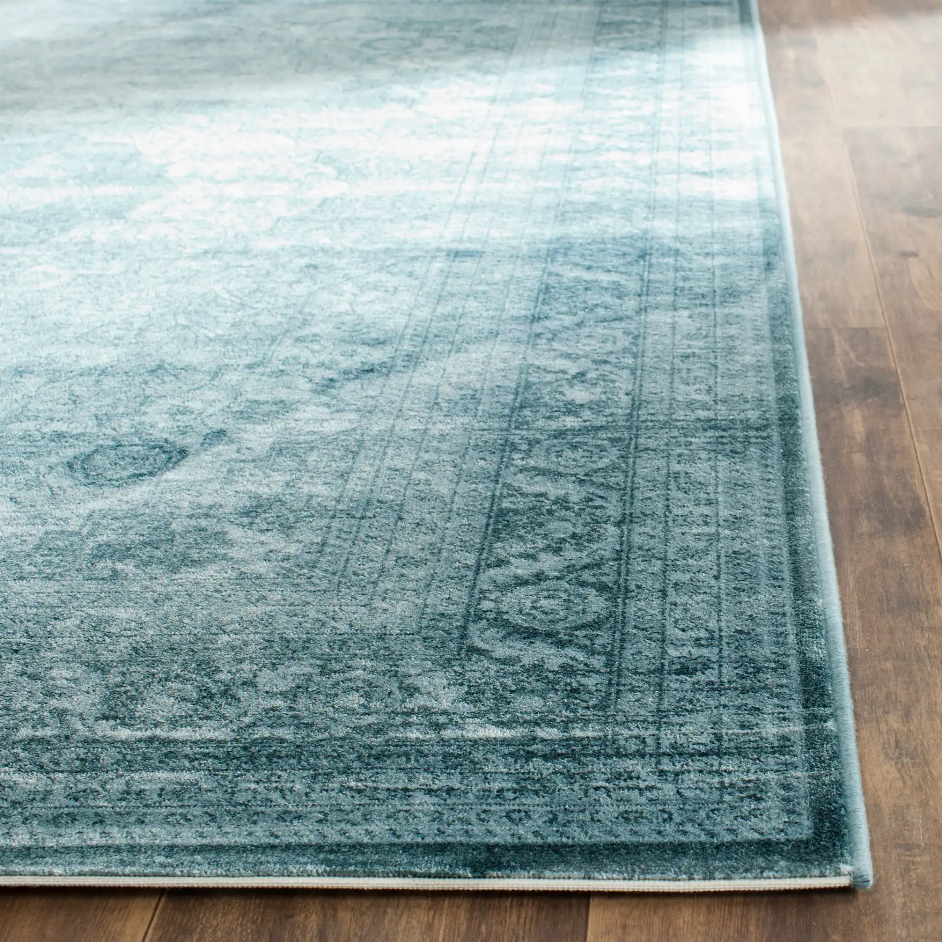 Vintage Ornamental Medallion Viscose Rug in Light Blue / Dark Blue in a styled room