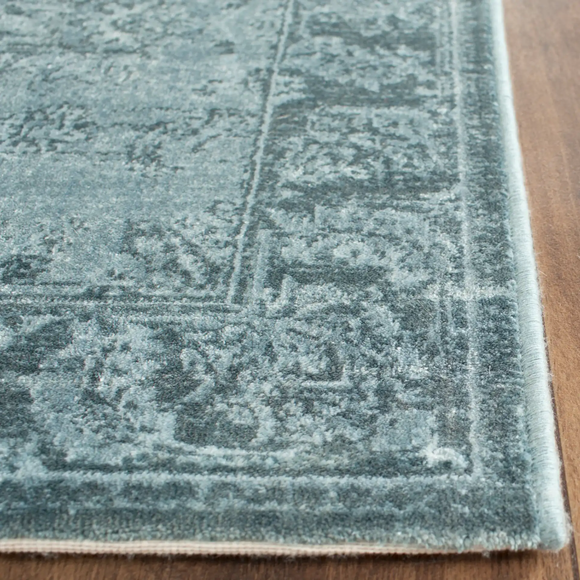 Vintage Floral Bordered Viscose Rug in Light Blue / Dark Blue in a styled room