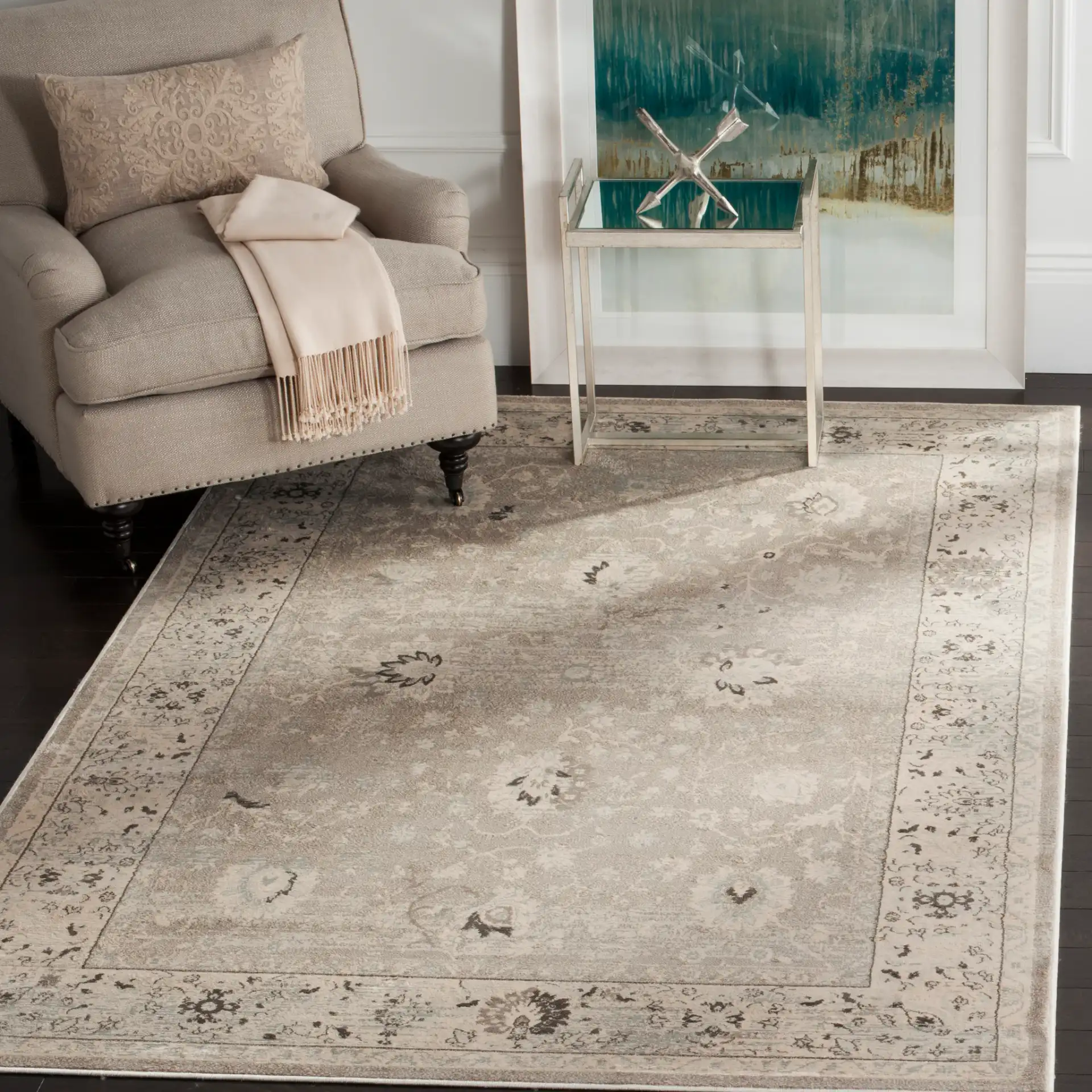 Vintage Distressed Bordered Rug in Light Gray / Ivory in a styled room