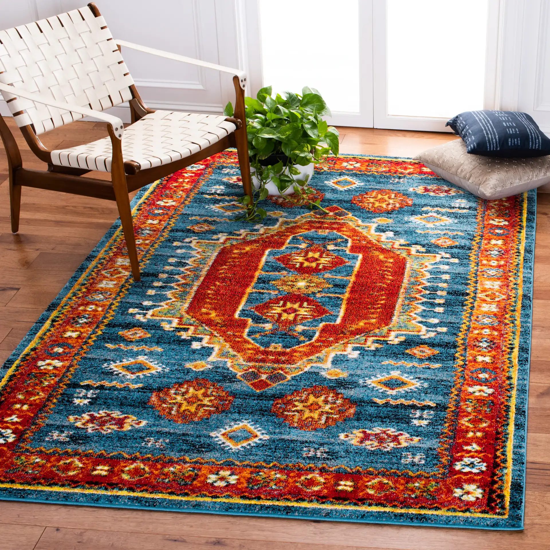 Vintage Hamadan Southwestern Medallion Rug in Blue / Orange in a styled room