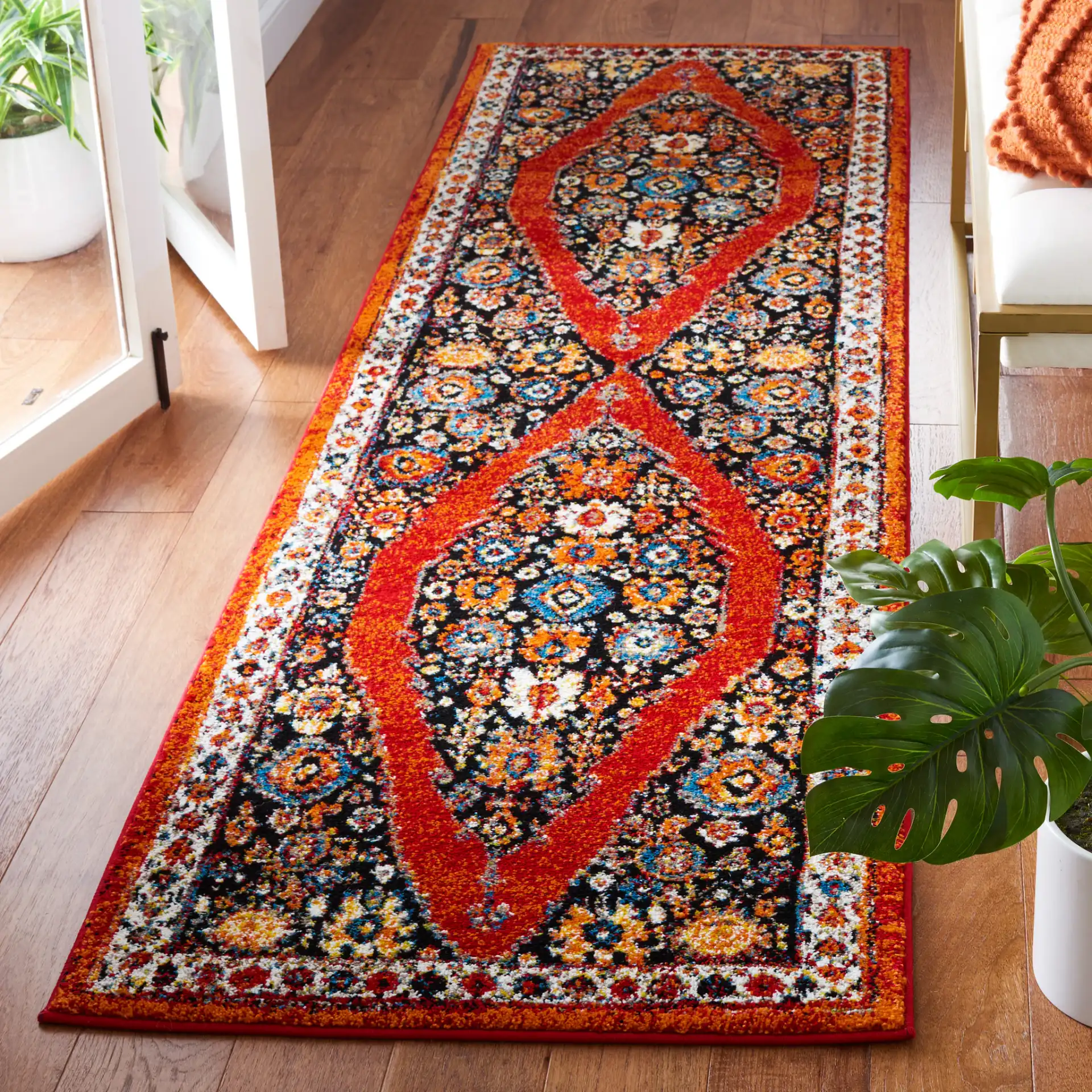 Vintage Hamadan Floral Diamond Medallion Rug in Red / Black in a styled room