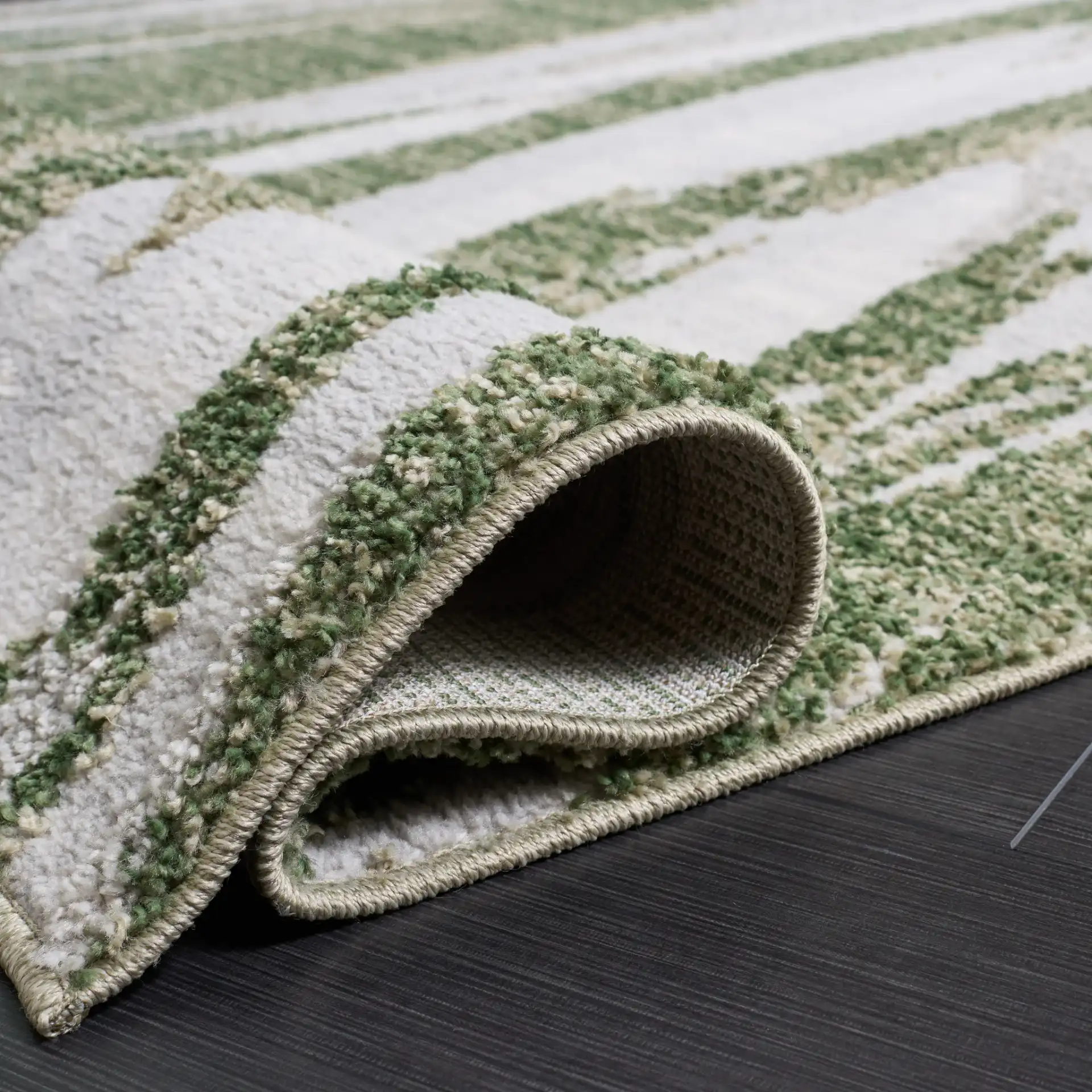 Wave Abstract Stripe Rug in Green / Ivory in a styled room