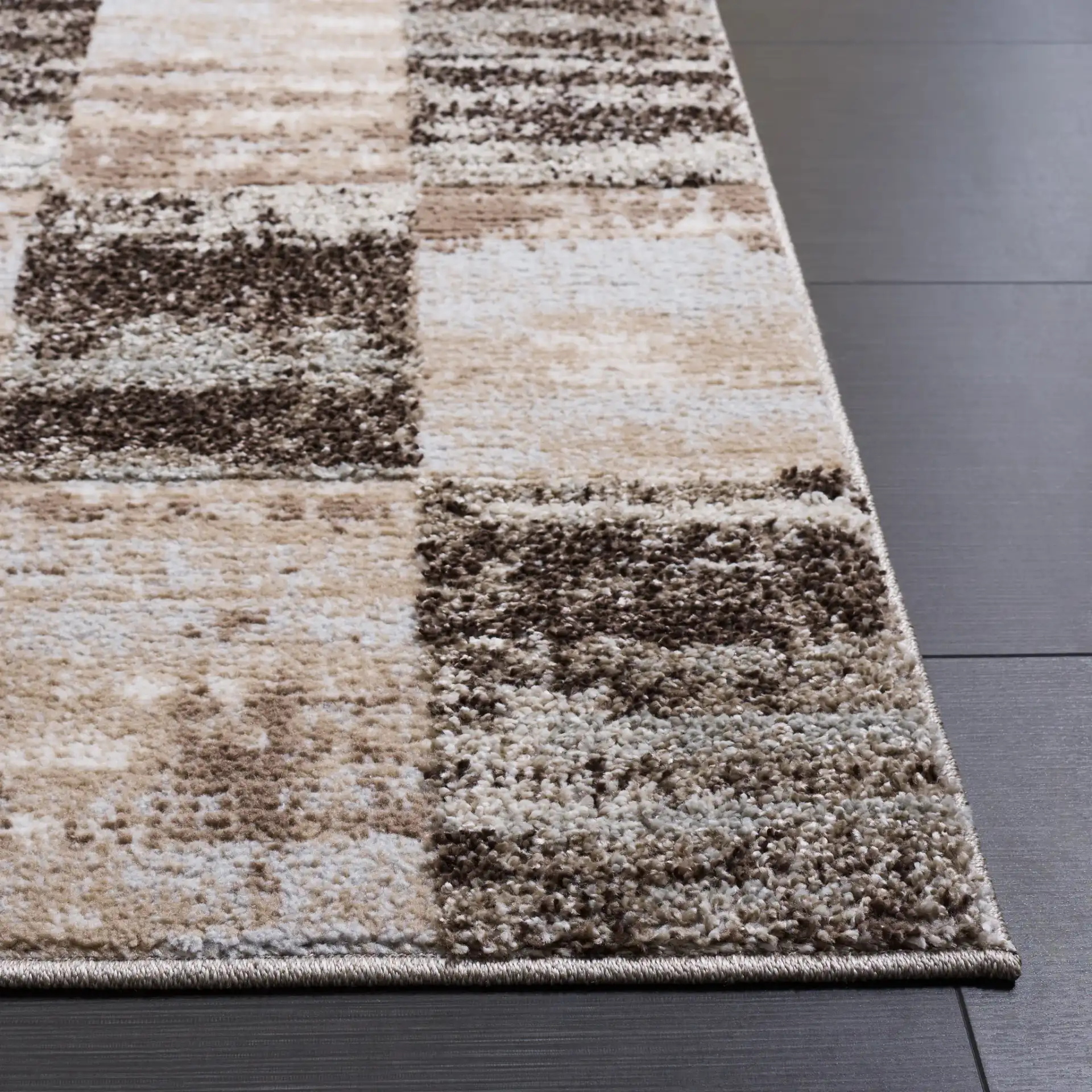 Wave Checkered Rug in Beige / Gray in a styled room