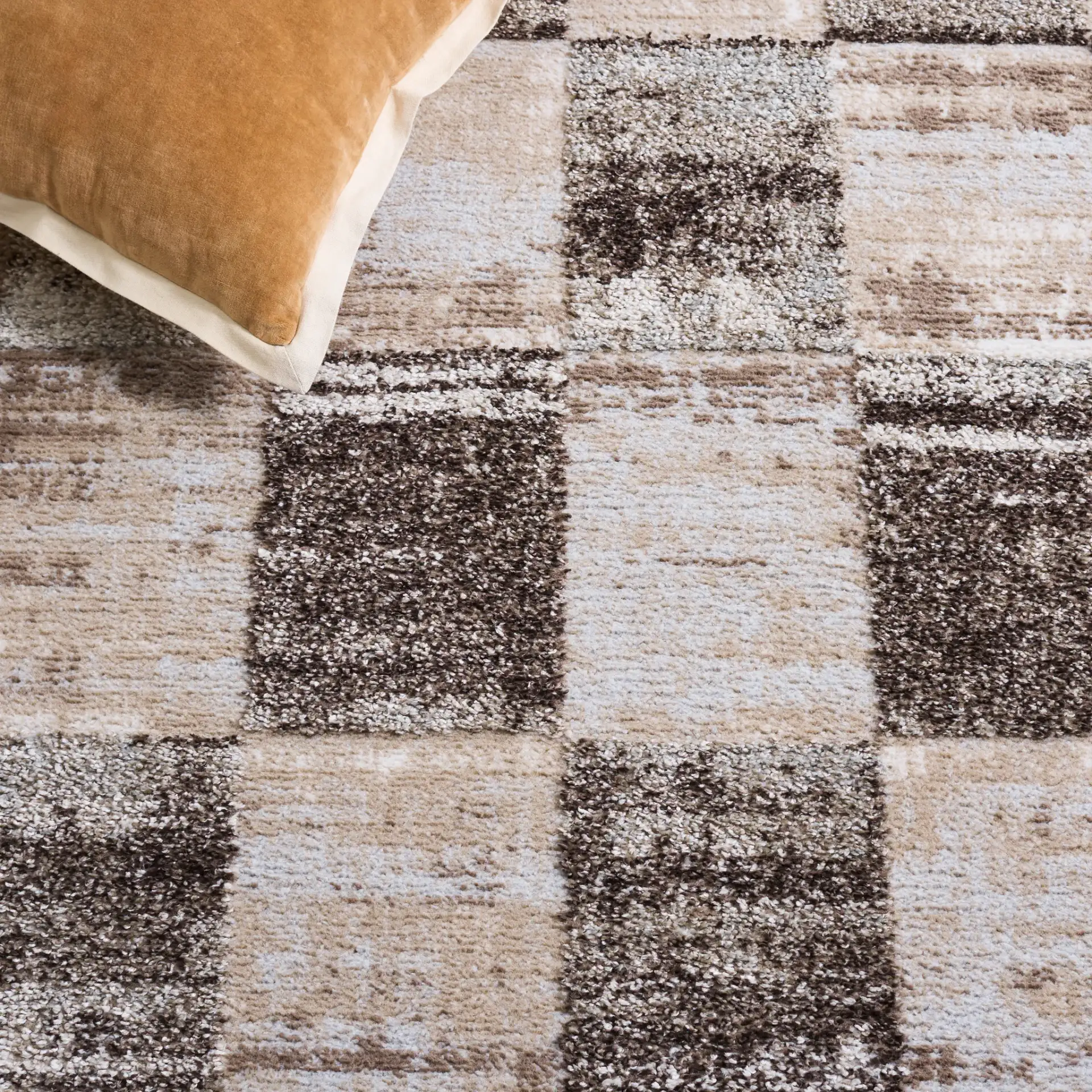 Wave Checkered Rug in Beige / Gray in a styled room