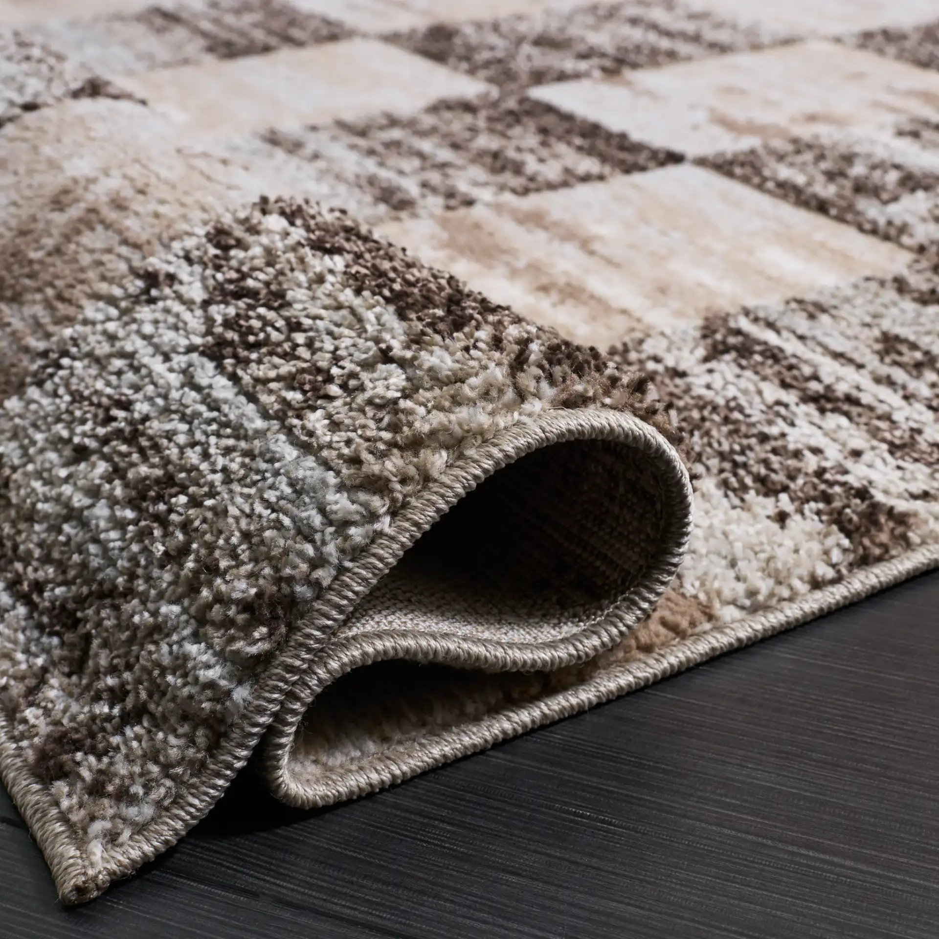 Wave Checkered Rug in Beige / Gray in a styled room