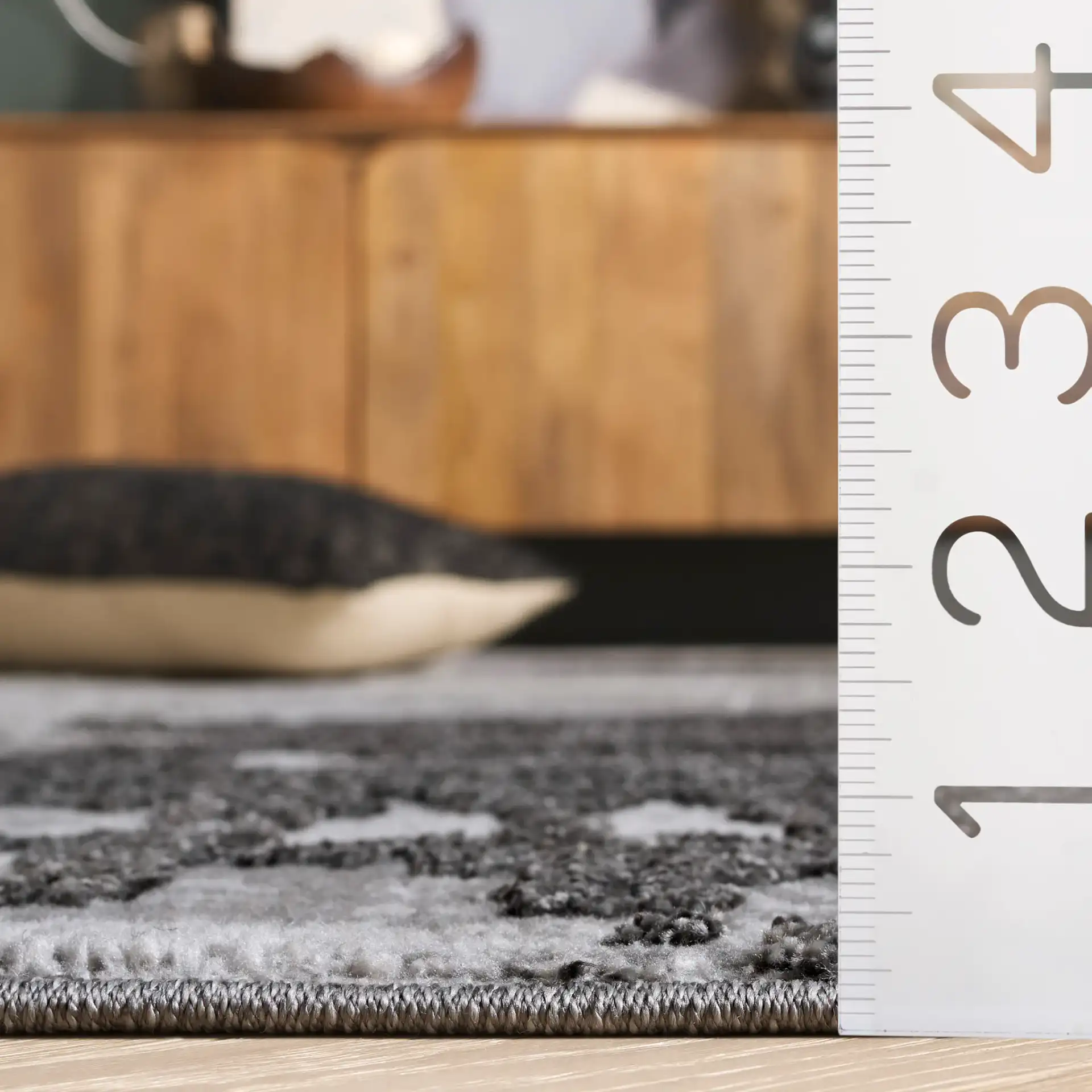 Wave Painterly Abstract Rug in Gray / Light Gray in a styled room