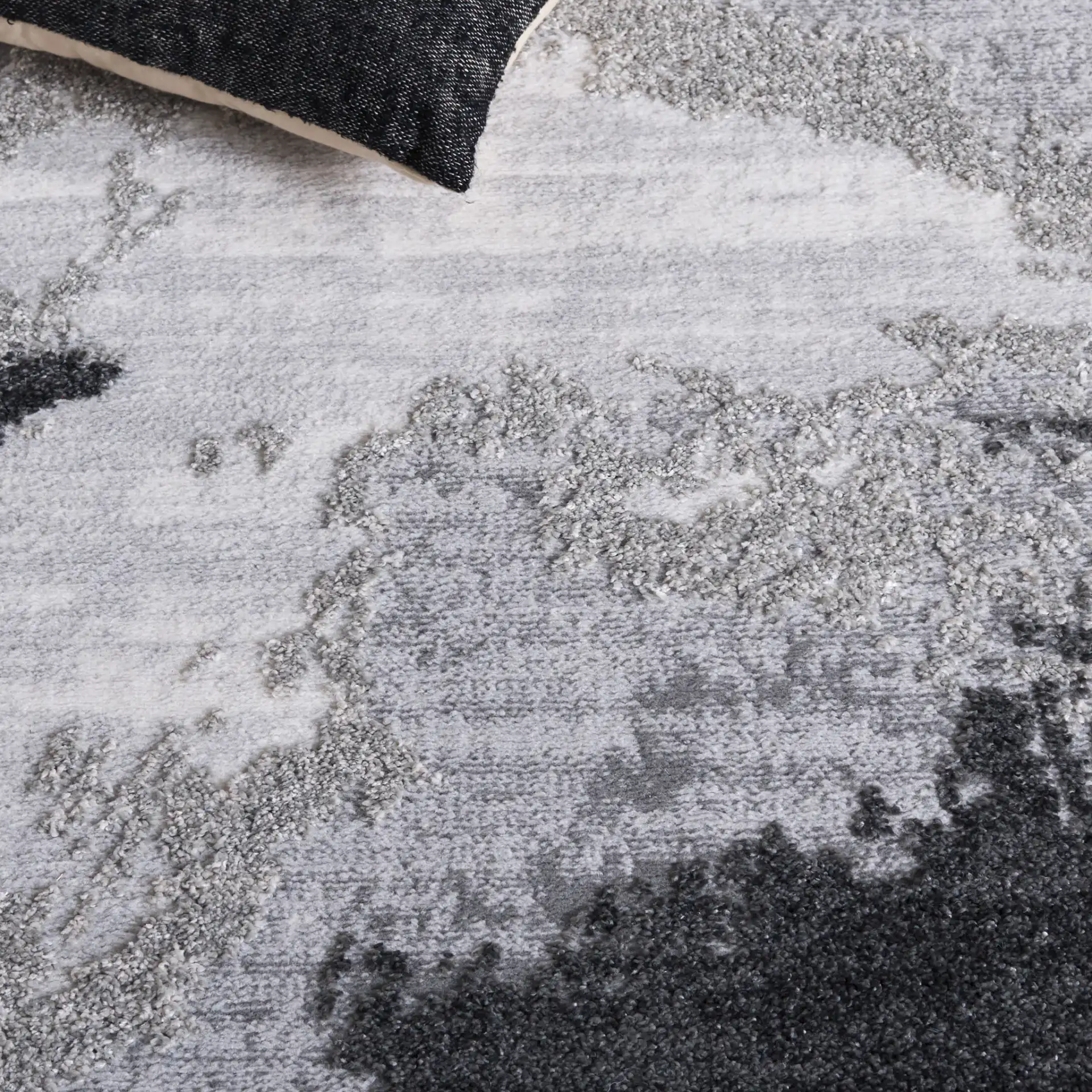 Wave Painterly Abstract Rug in Gray / Light Gray in a styled room