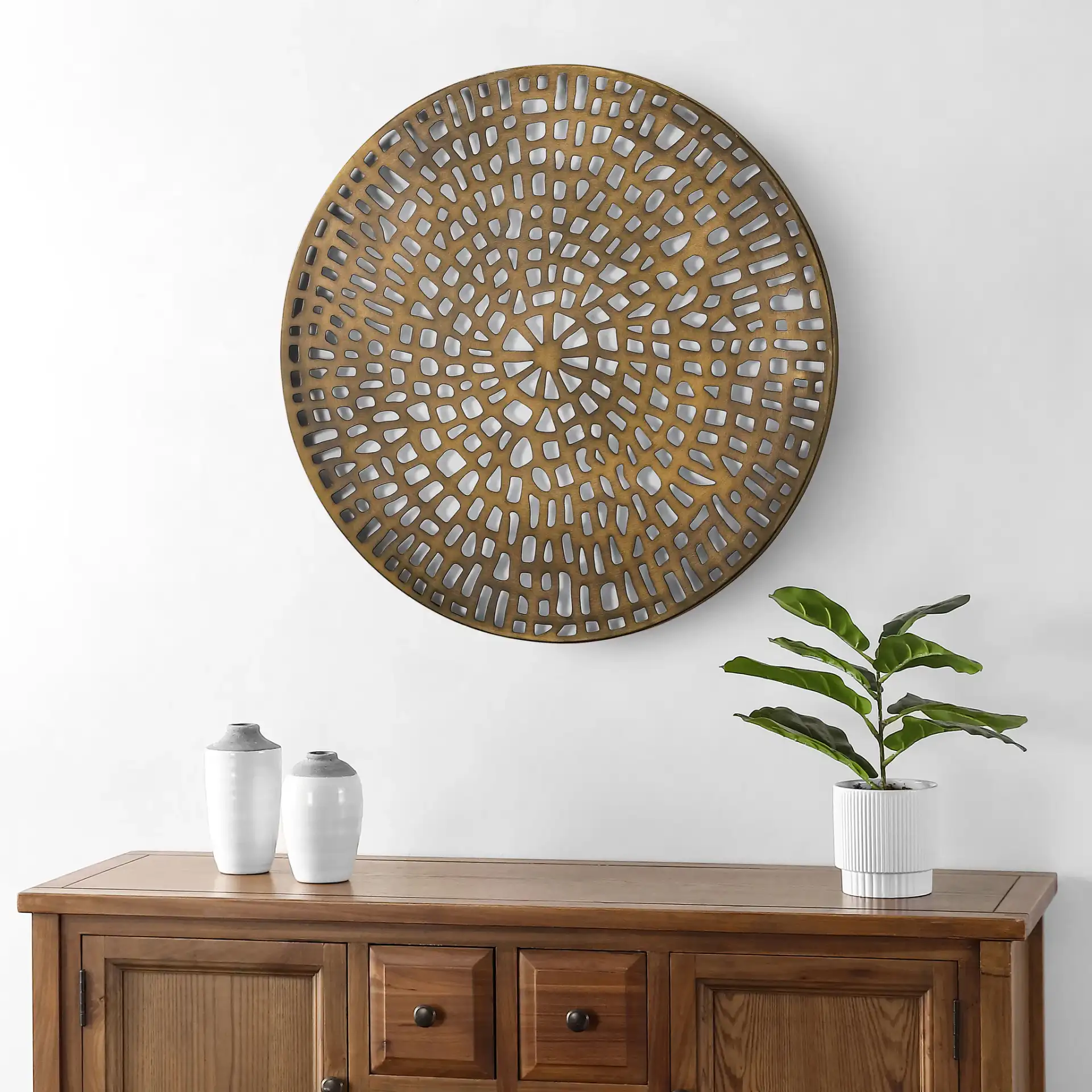 Leofe Wall Decor in Antique Brass in a styled room
