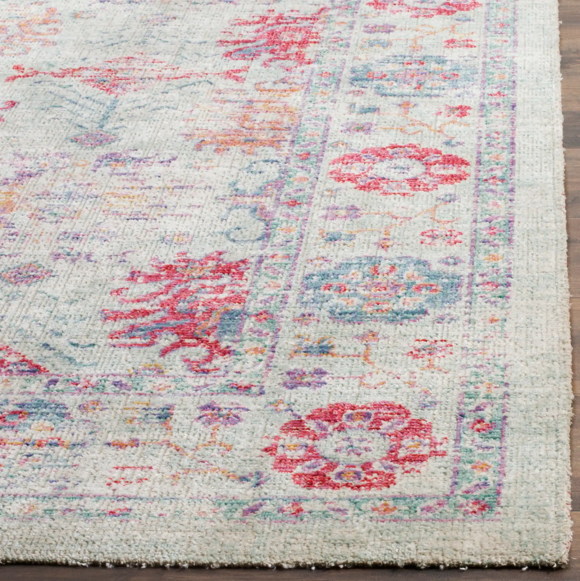 Windsor Antalya Distressed Bordered Rug in Ivory / Fuchsia in a styled room