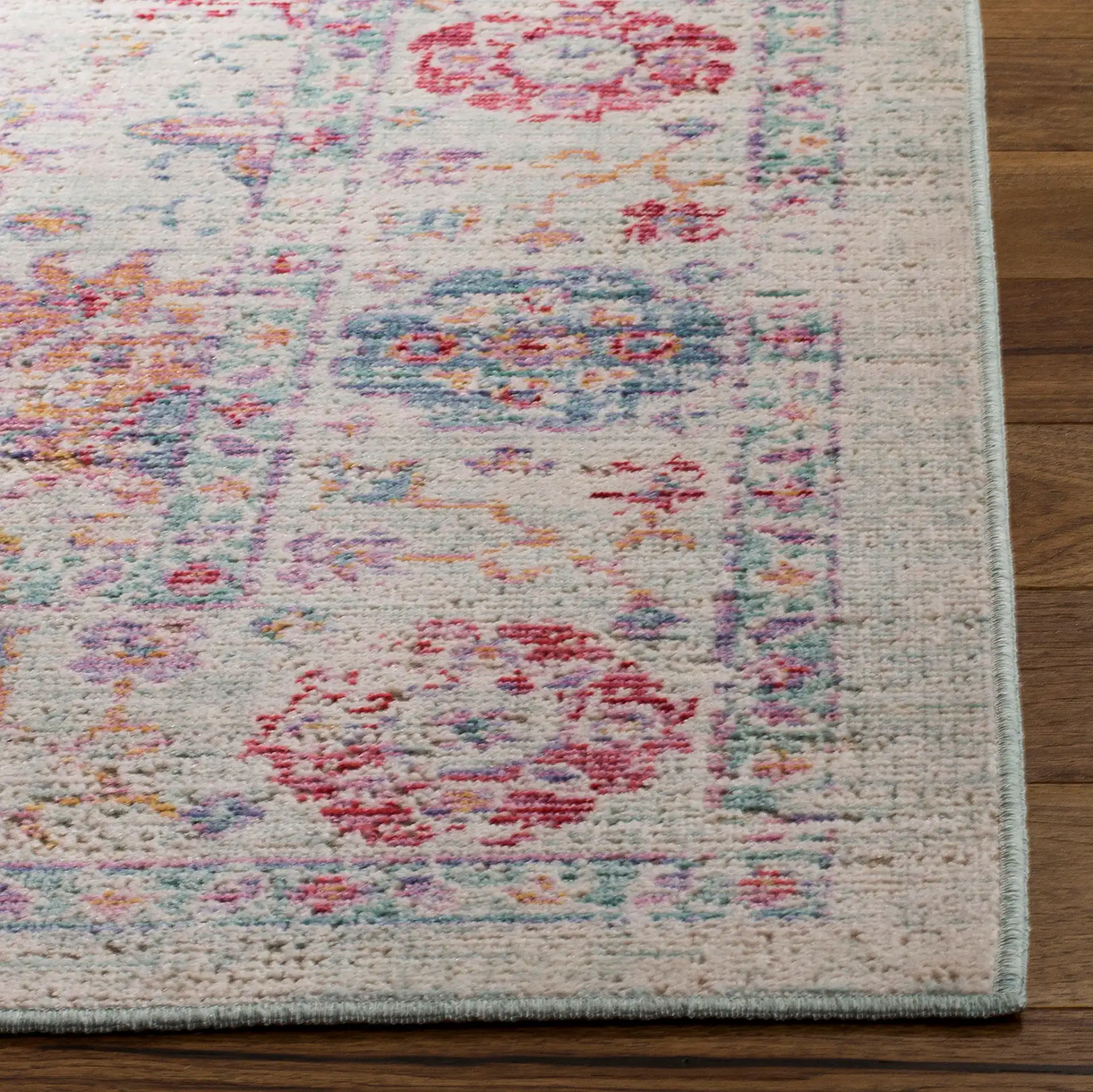 Windsor Antalya Distressed Bordered Rug in Ivory / Fuchsia in a styled room