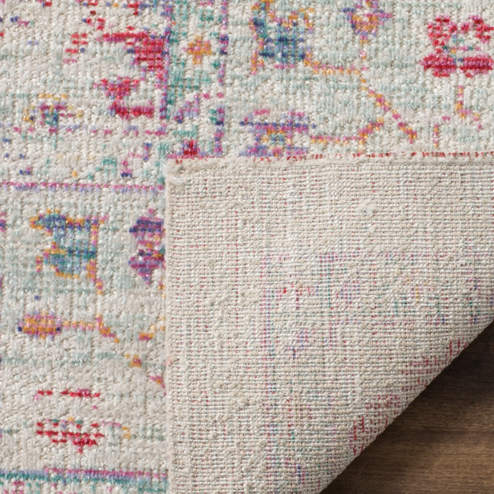Windsor Antalya Distressed Bordered Rug in Ivory / Fuchsia in a styled room