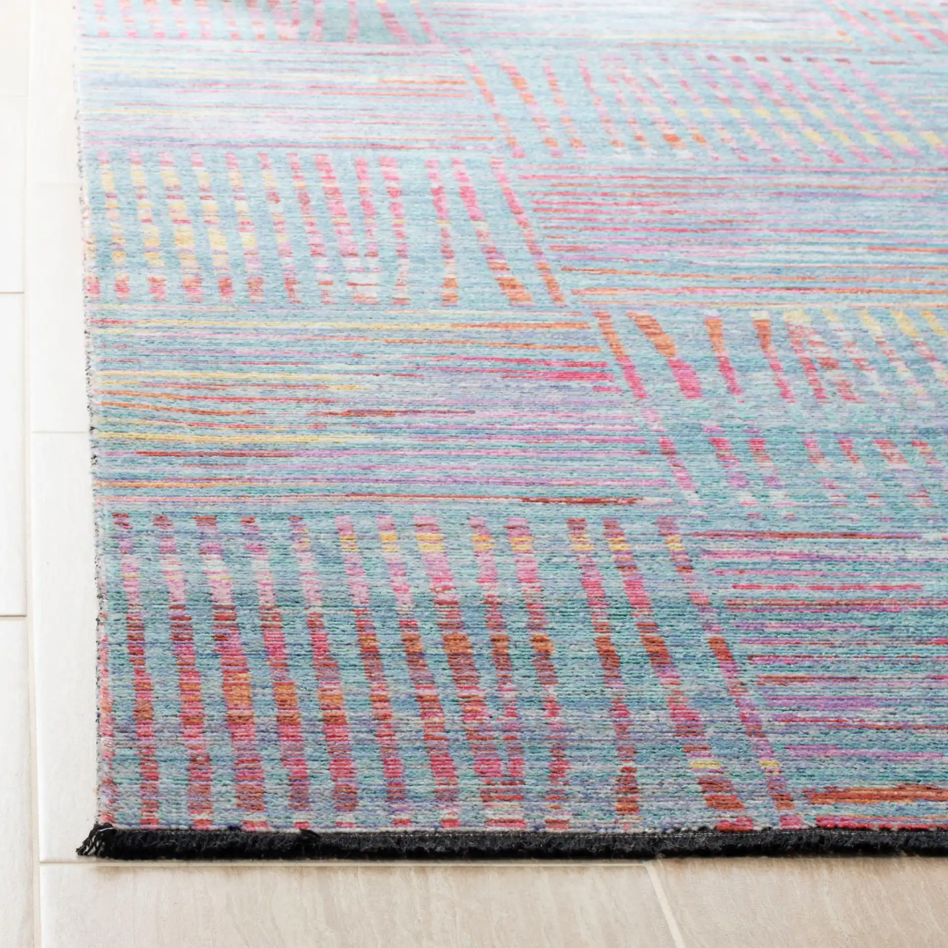 Windsor Abstract Grid Rug in Aqua / Dark Pink in a styled room