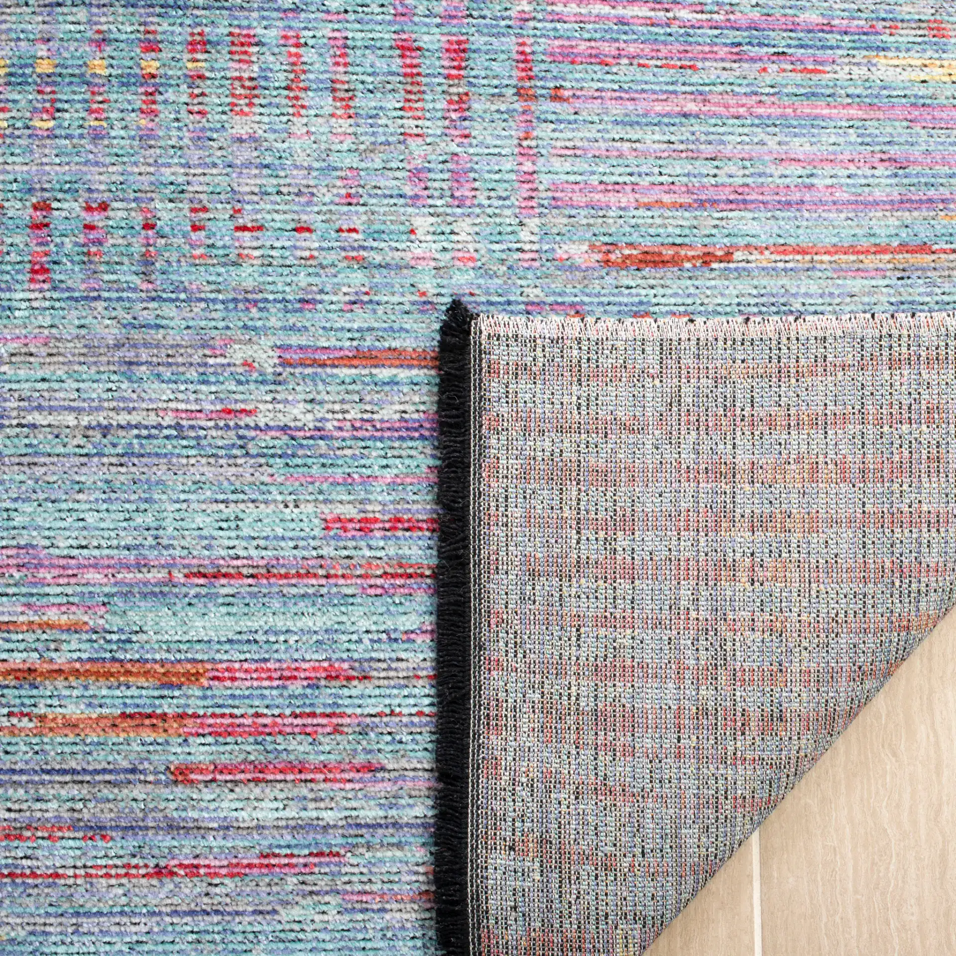 Windsor Abstract Grid Rug in Aqua / Dark Pink in a styled room