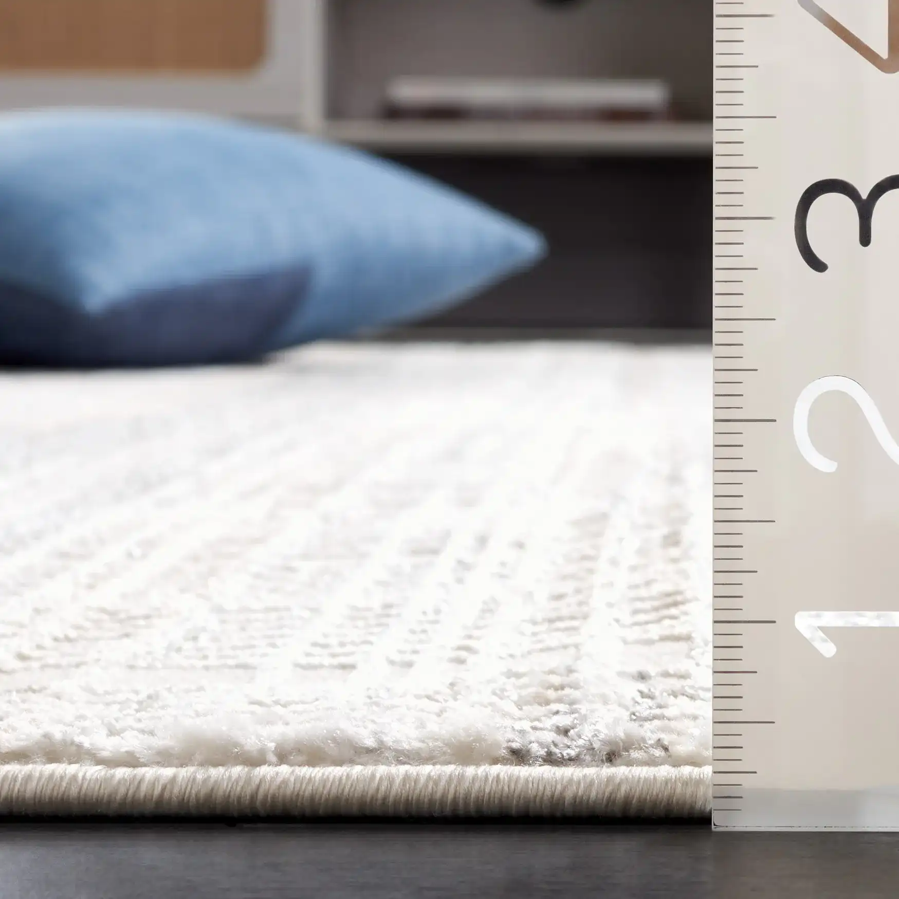 Whisper Linear Stripe Rug in Ivory / Gray in a styled room