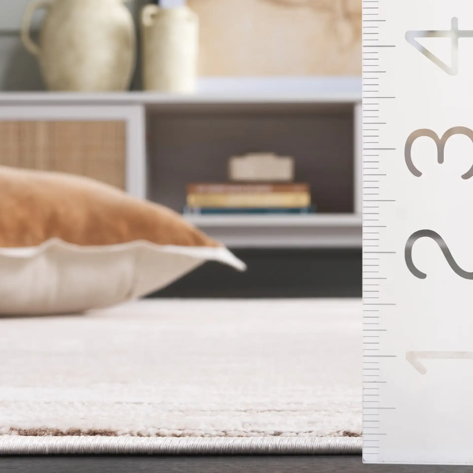 Whisper Striated Rug in Beige / Dark Beige in a styled room