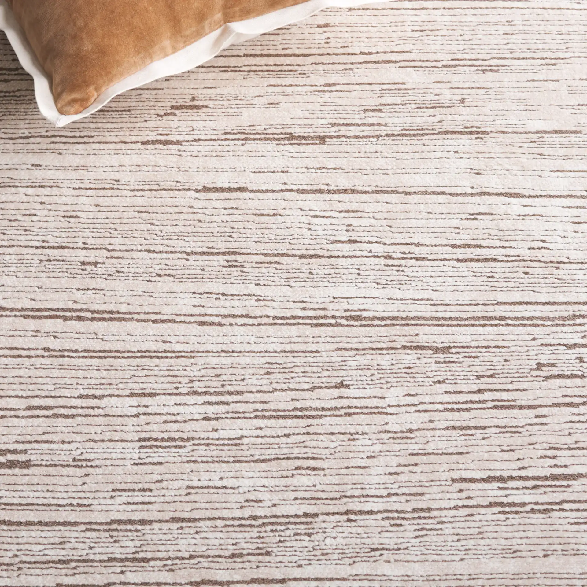 Whisper Striated Rug in Beige / Dark Beige in a styled room