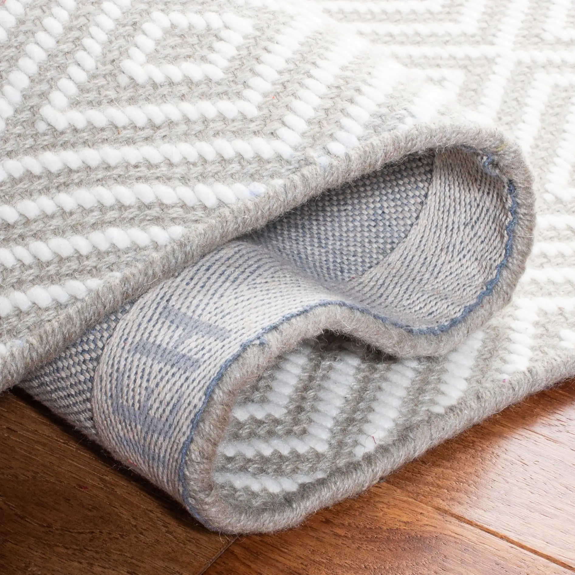 Wilton Nested Diamond Hand-Hooked Wool Rug in Light Gray / Ivory in a styled room