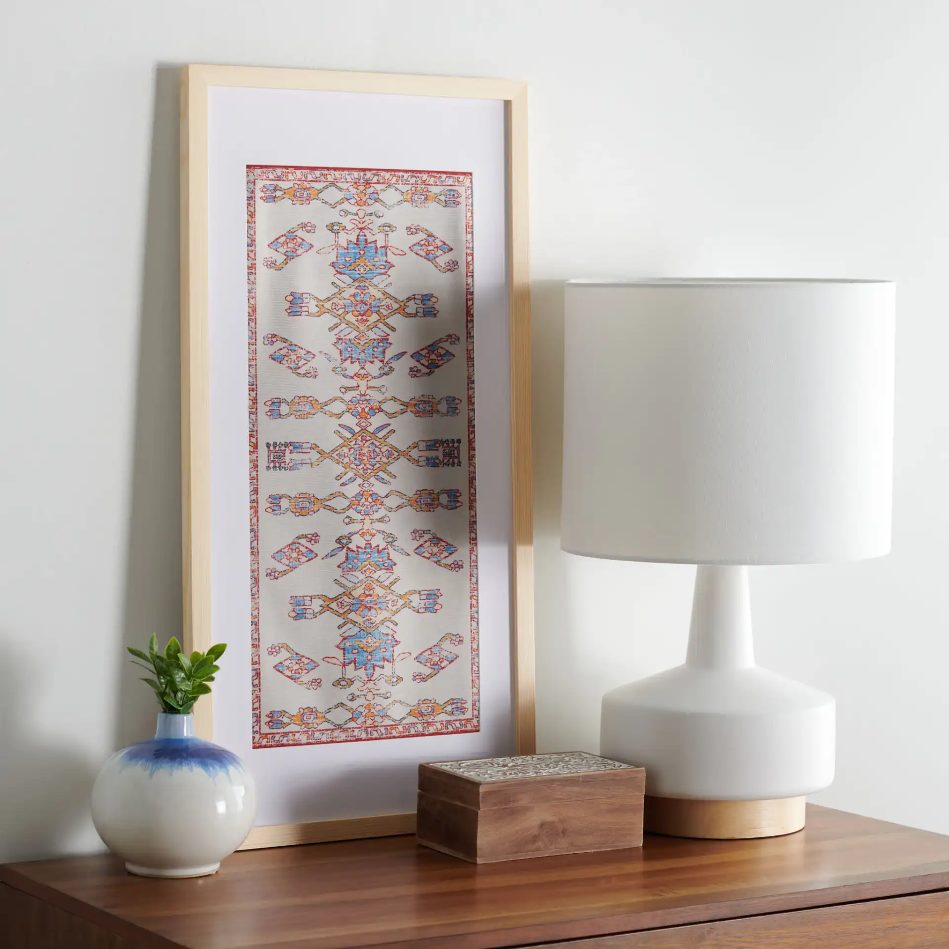 Khadijah Framed Textile in Blue / Orange in a styled room