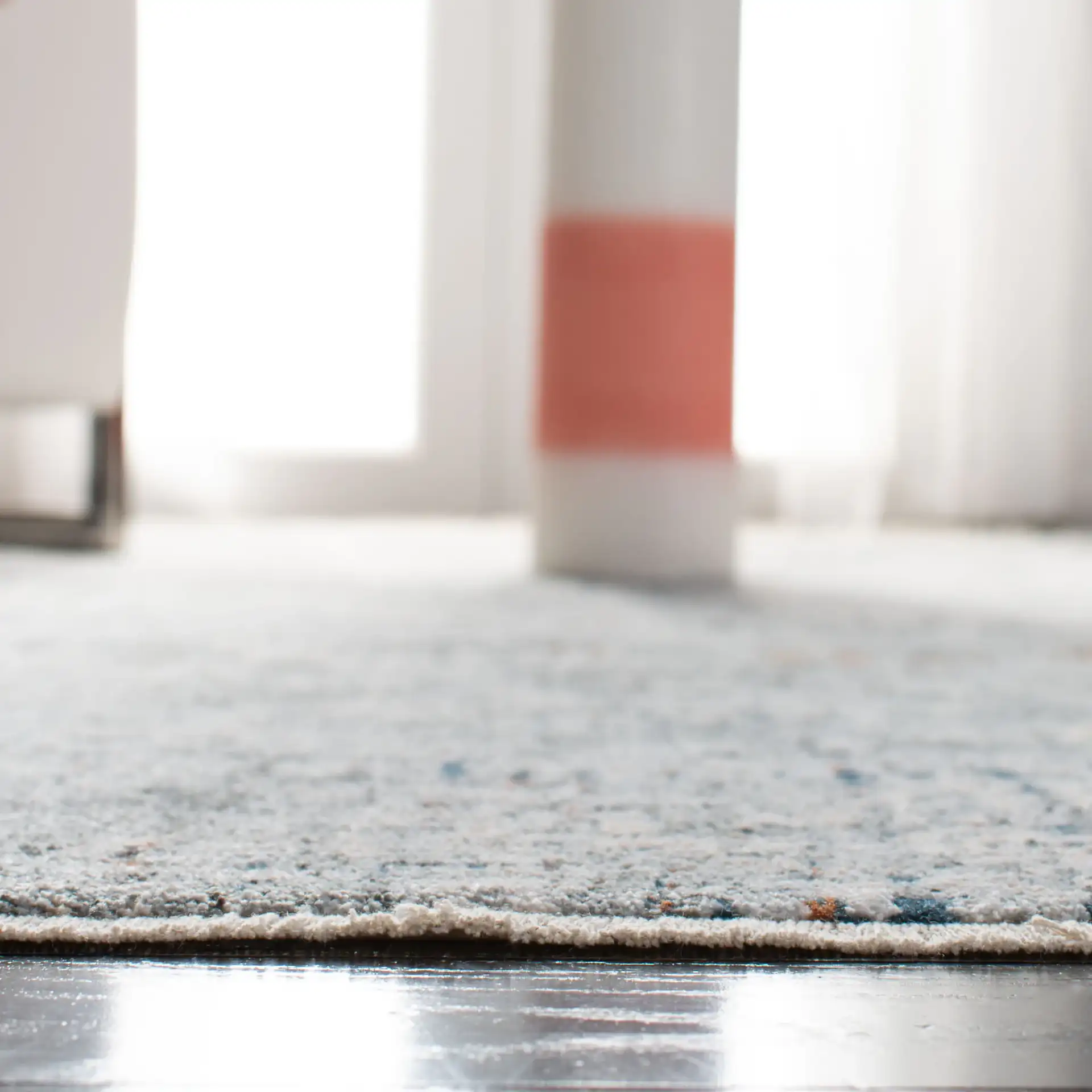 Winston Abstract Grid Rug in Gray / Beige in a styled room