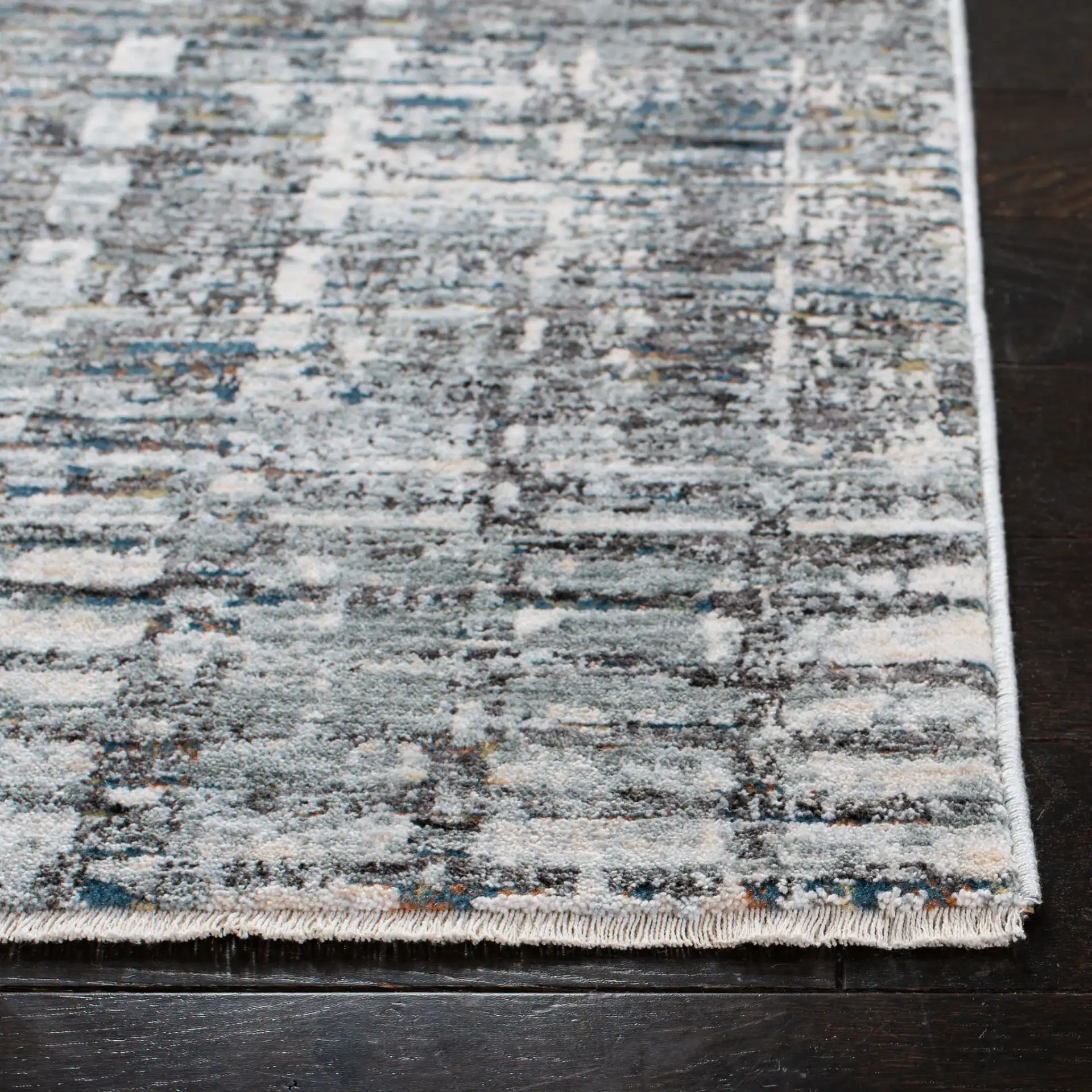 Winston Distressed Grid Rug in Gray / Beige in a styled room
