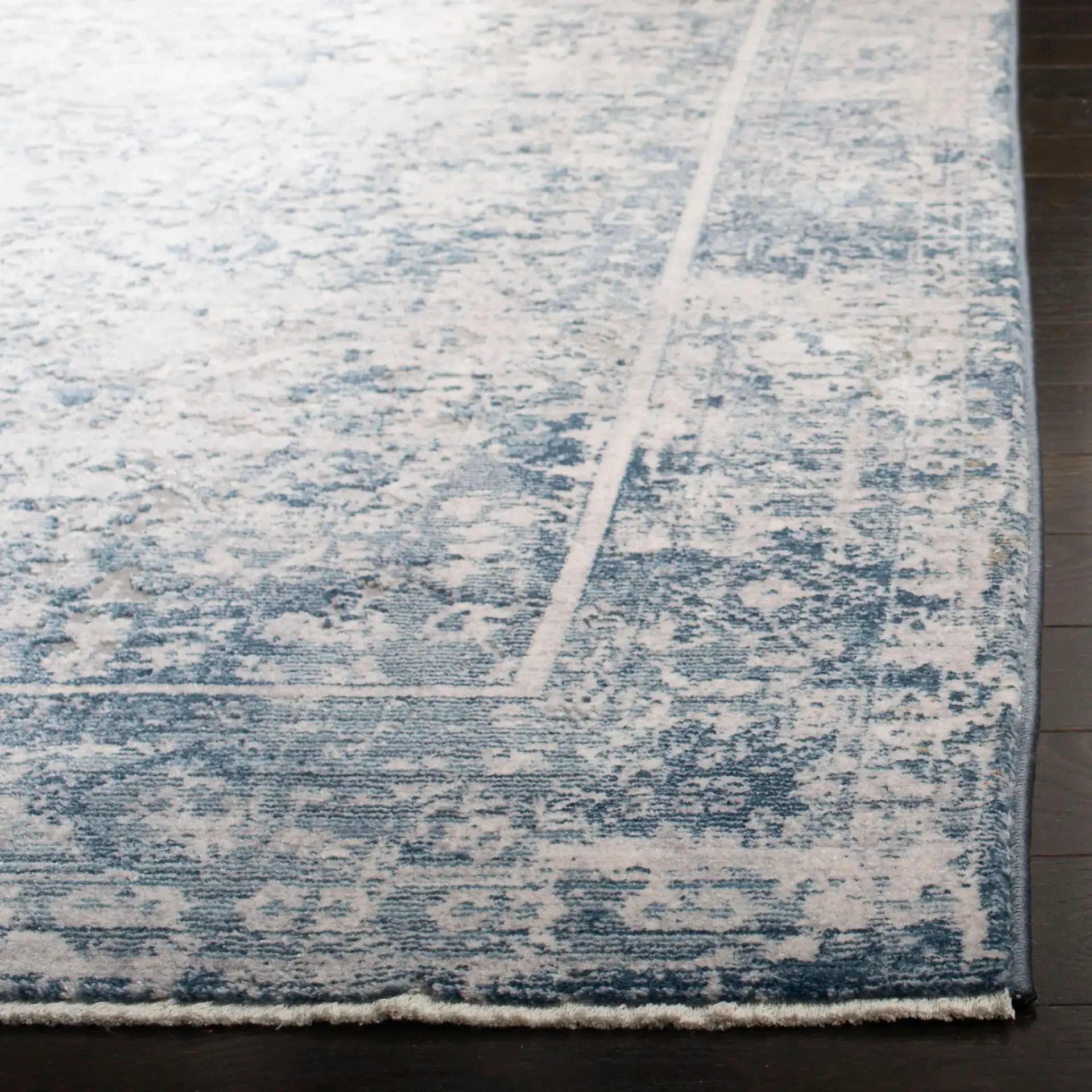 Winston Distressed Bordered Rug in Winston Distressed Bordered Rug in a styled room