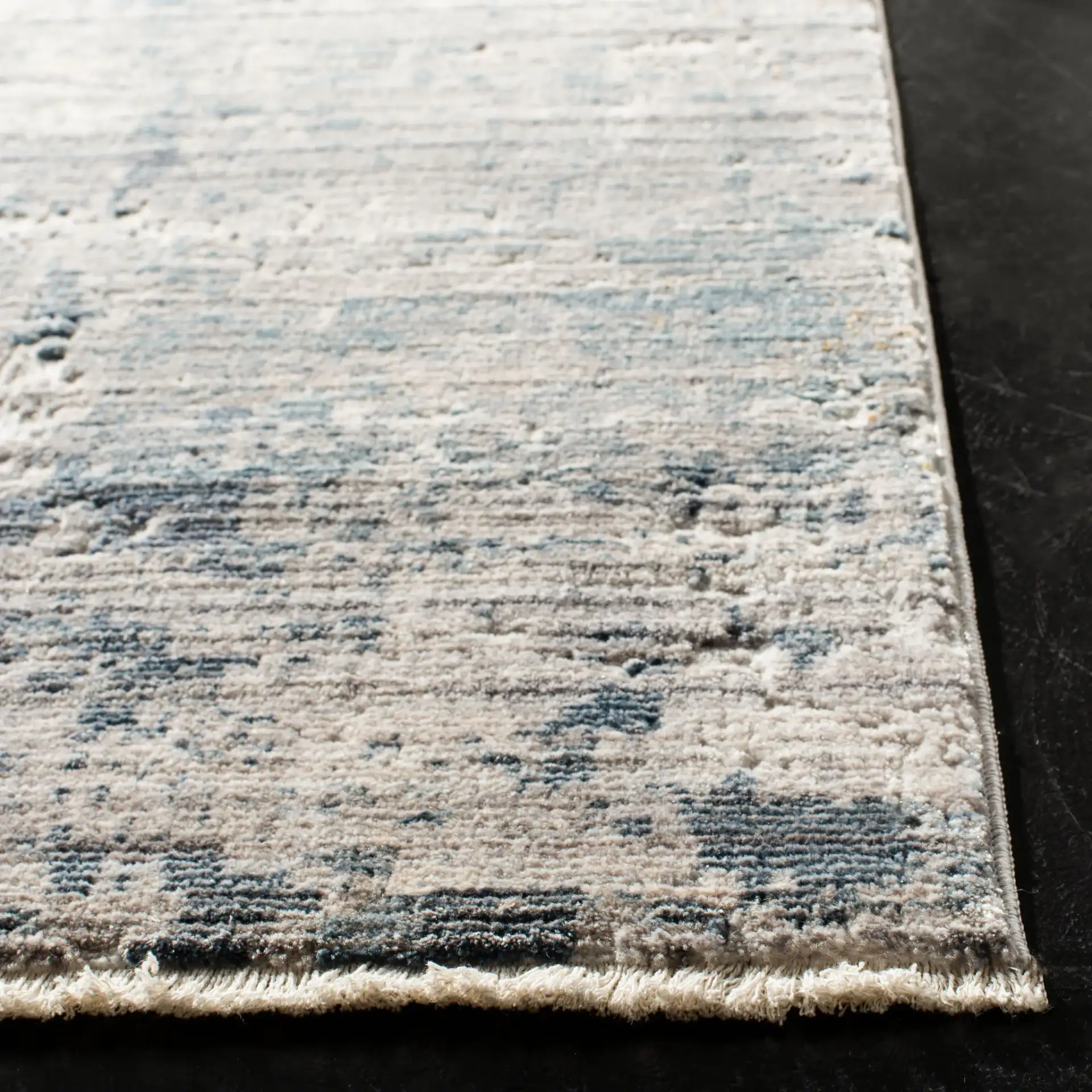 Winston Abstract Rug in Gray / Blue in a styled room