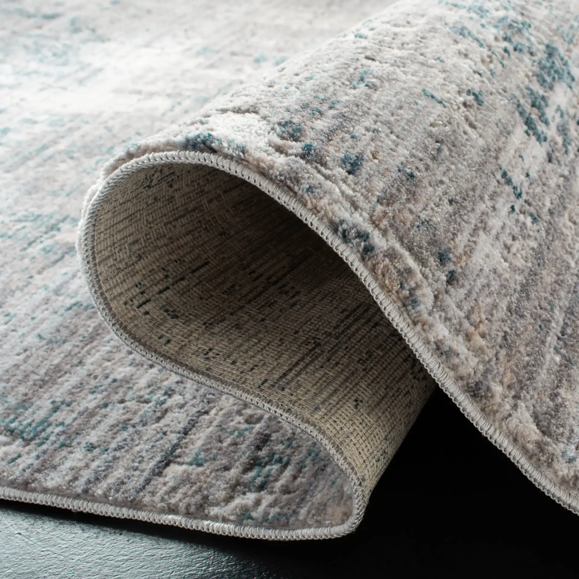 Winston Abstract Rug in Gray / Blue in a styled room