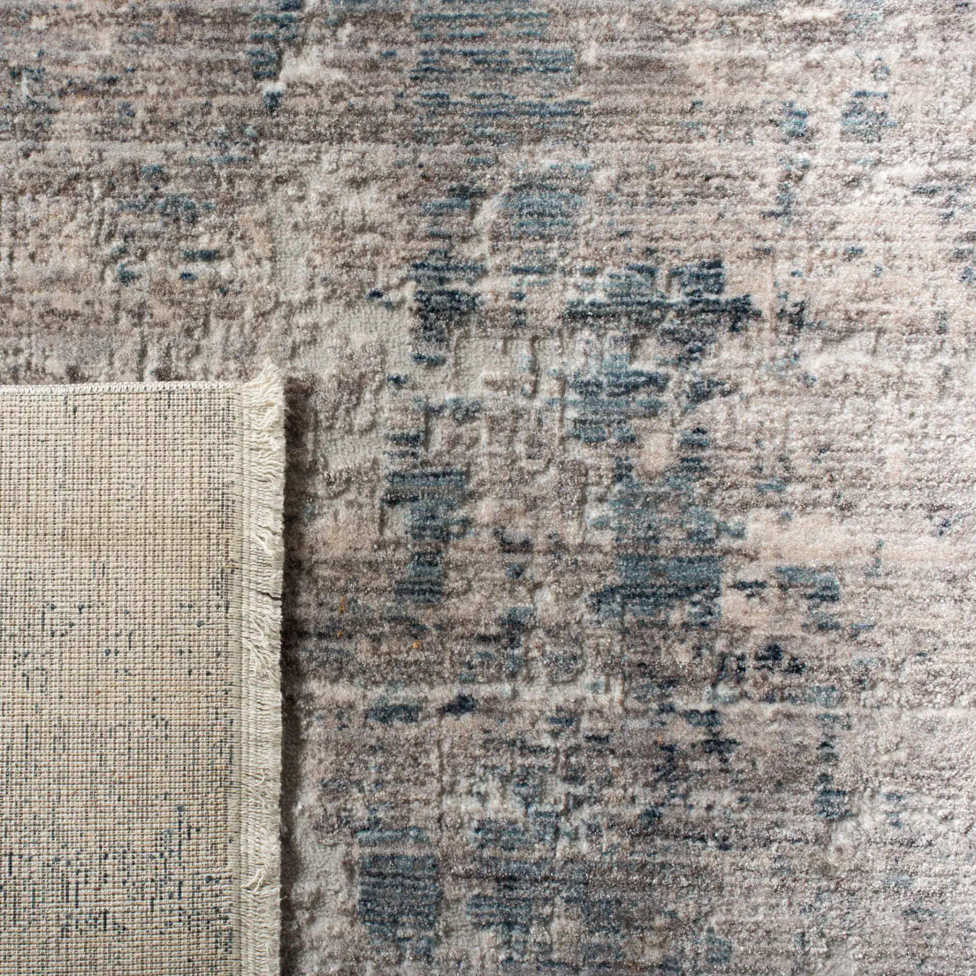 Winston Abstract Rug in Gray / Blue in a styled room