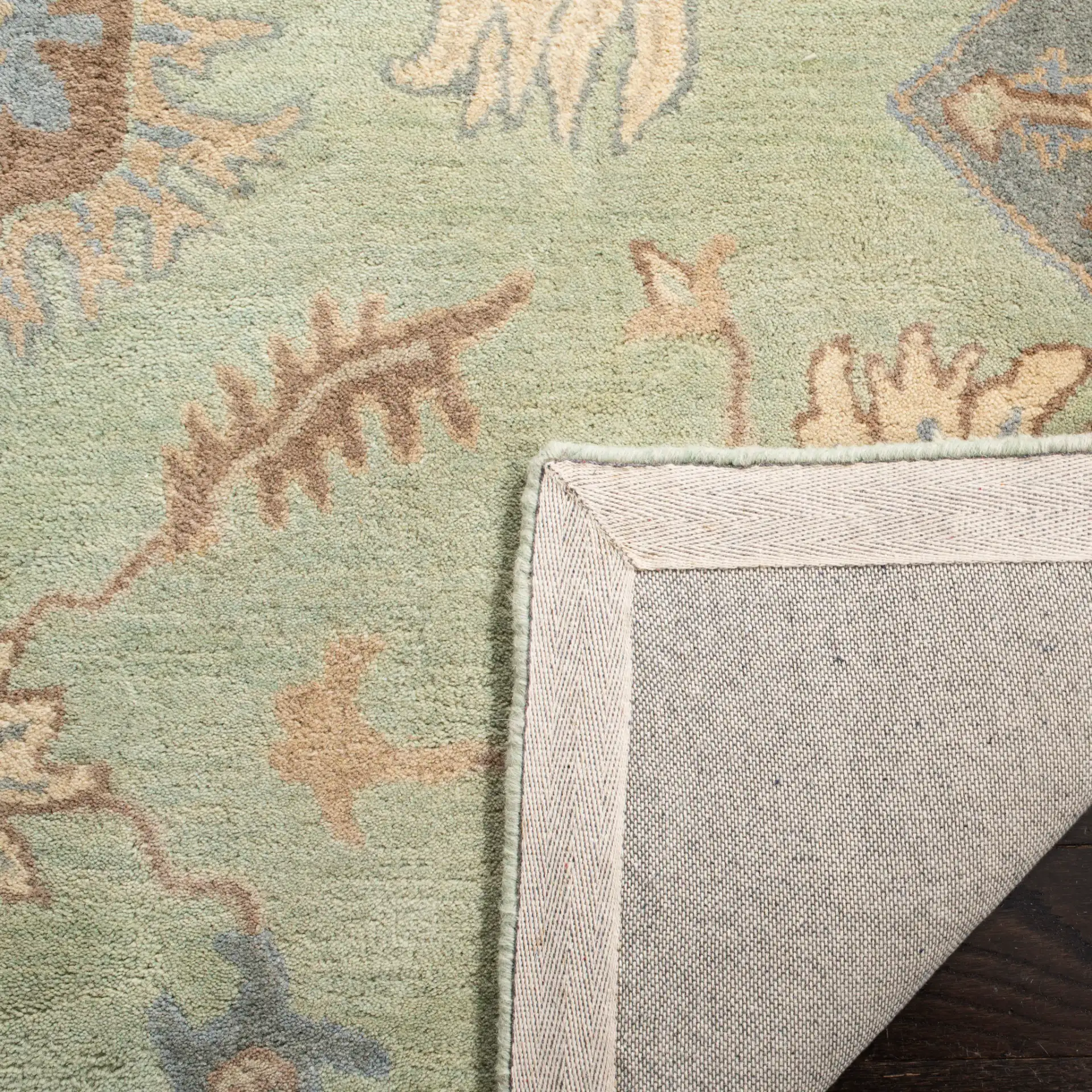 Wyndham Allover Botanical Wool Rug in Light Green in a styled room