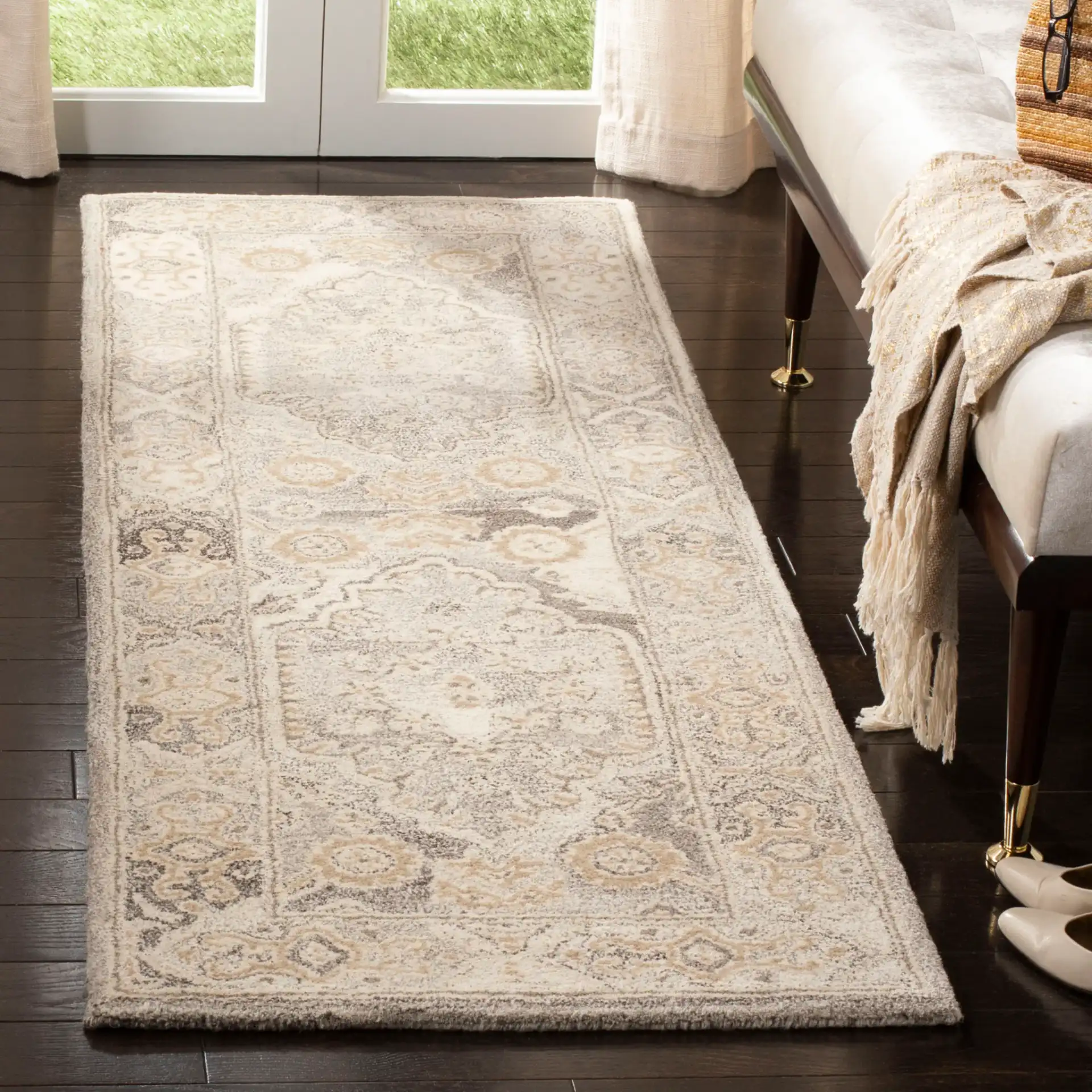 Wyndham Medallion Bordered Hand-Tufted Wool Rug in Light Gray in a styled room