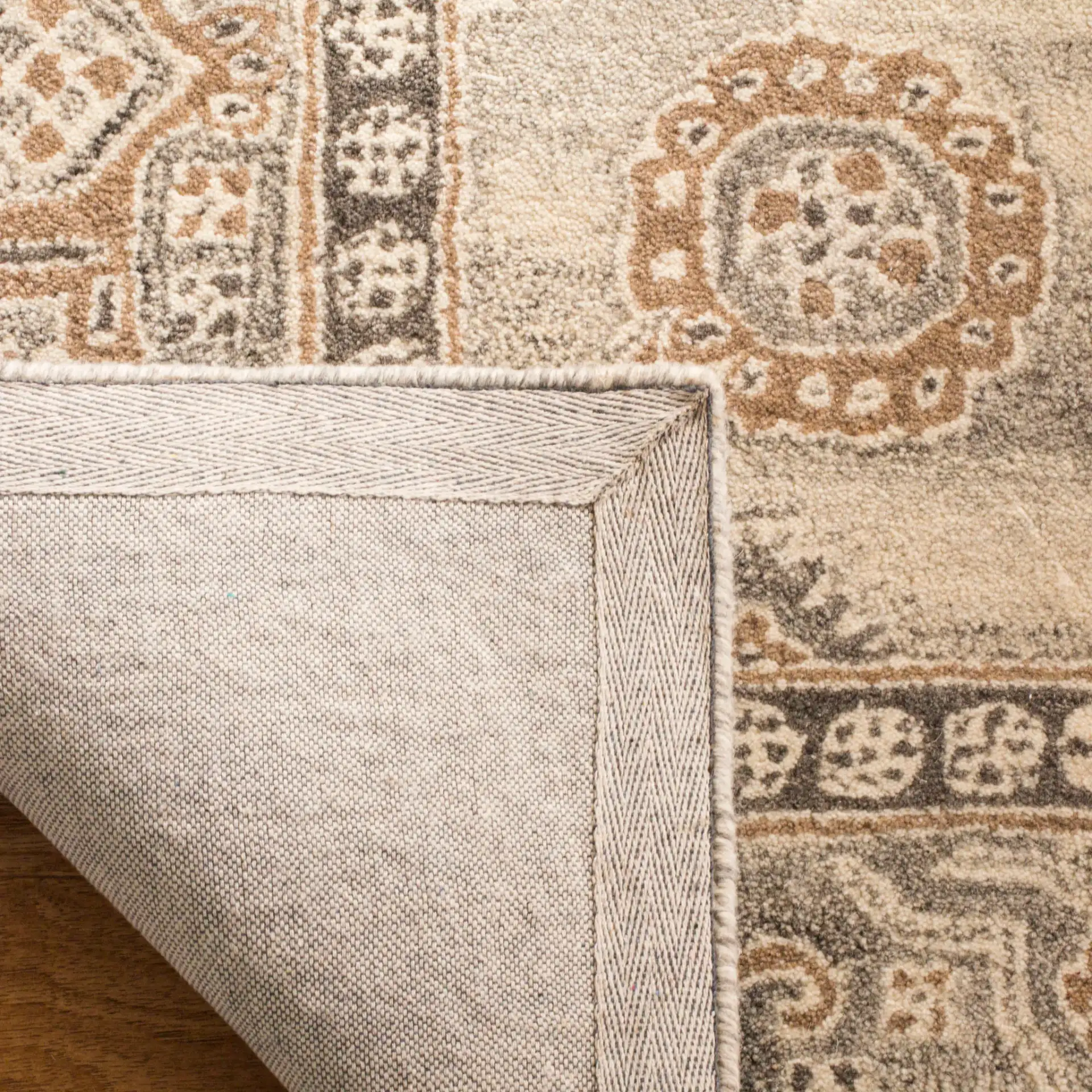 Wyndham Medallion Bordered Hand-Tufted Wool Rug in Light Gray in a styled room