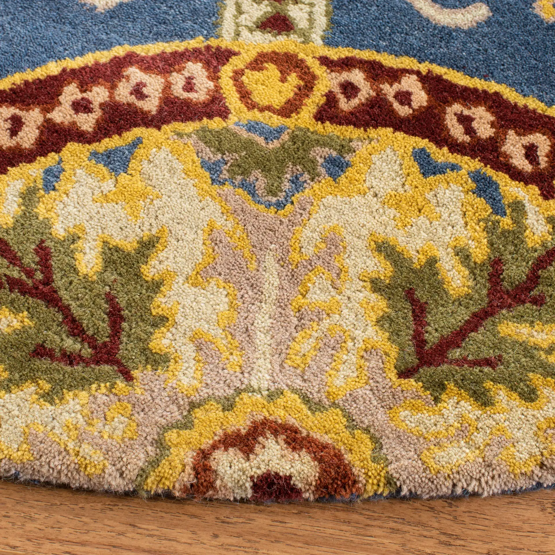 Wyndham Medallion Grid Hand-Tufted Wool Rug in Blue / Gold in a styled room