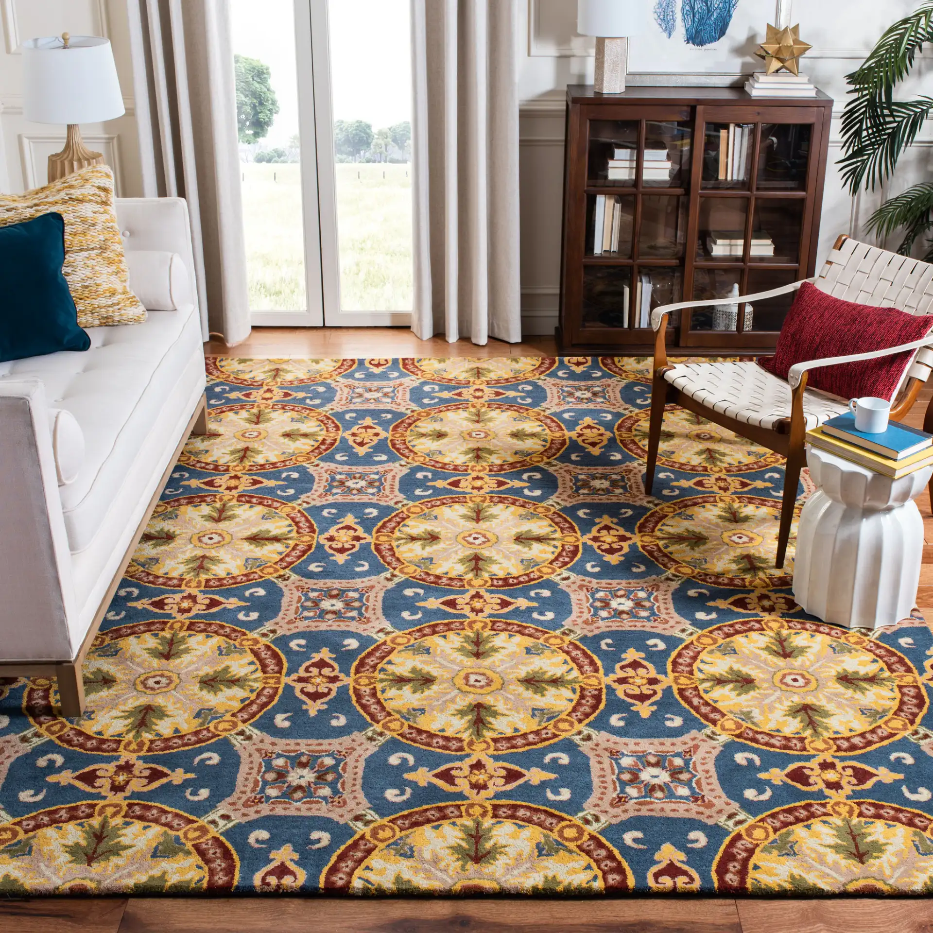 Wyndham Medallion Grid Hand-Tufted Wool Rug in Blue / Gold in a styled room